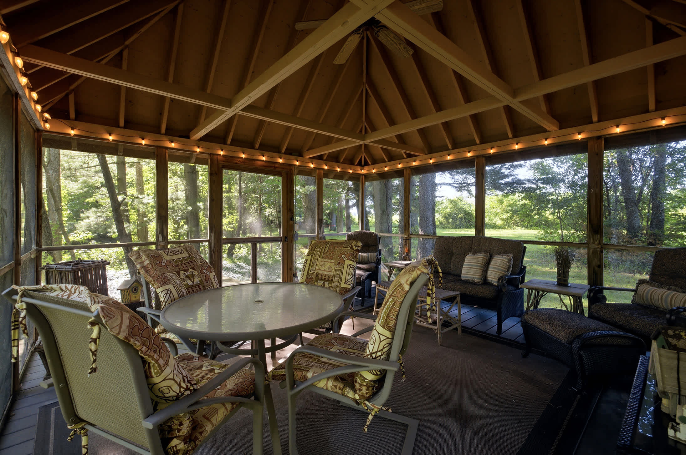 Cushioned seats, soft light, and the woods all around.