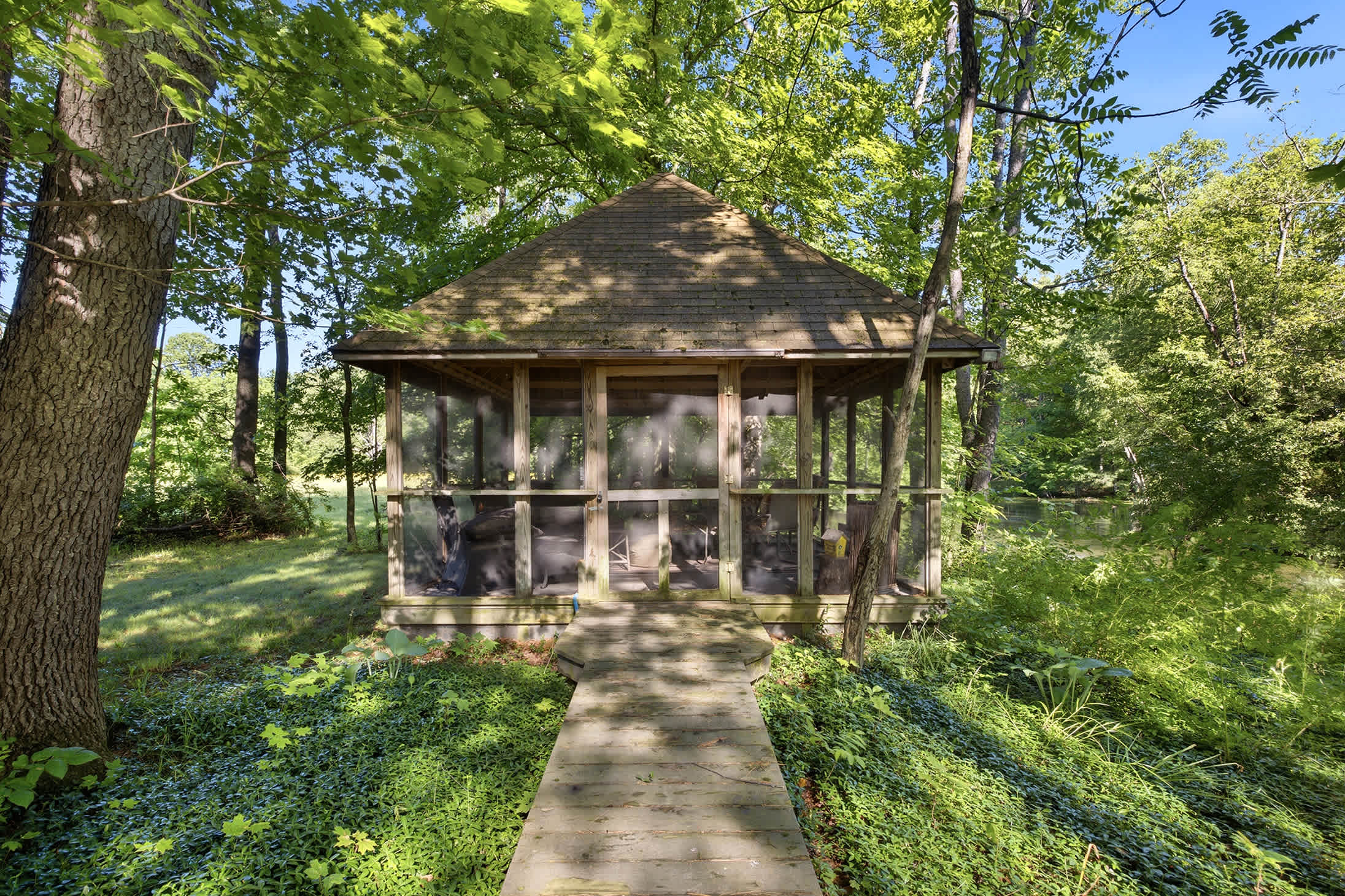 A quiet forest hideaway awaits in the Berrywood Farm gazebo.