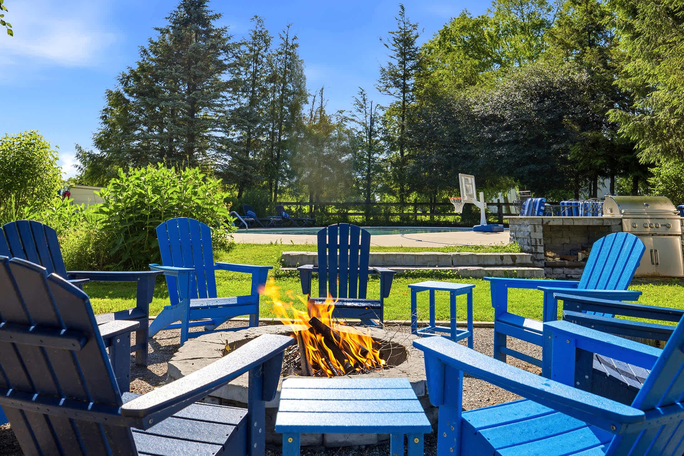 Settle in by the flames with the pool just steps away.