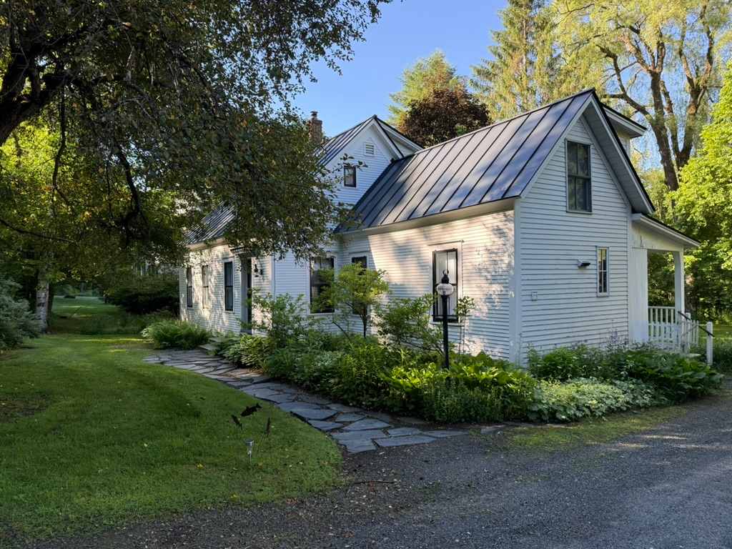Classic Vermont cottage on a landscaped lot, moments from Woodstock Village