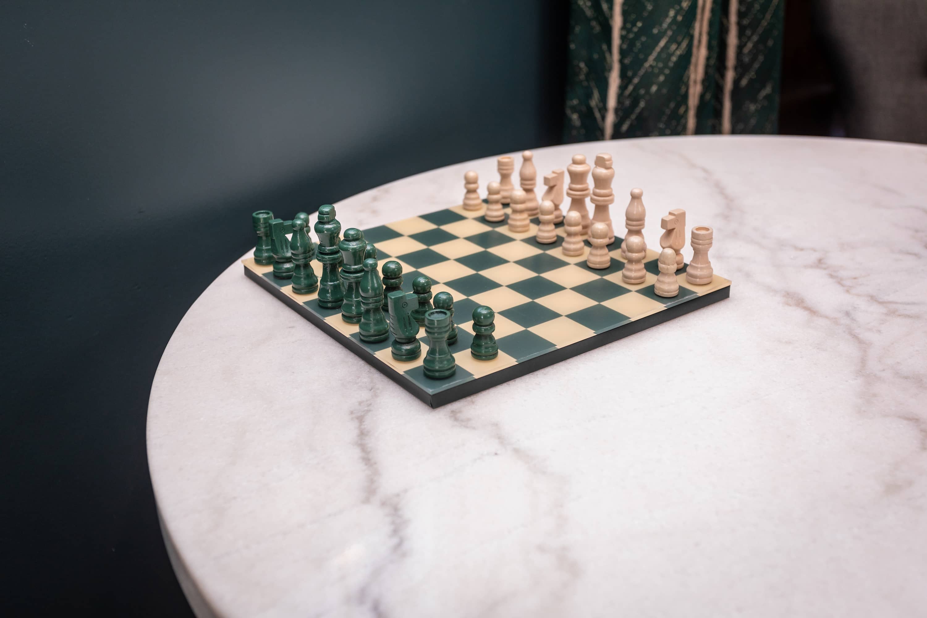 Chess set on a marble table ready for a game
