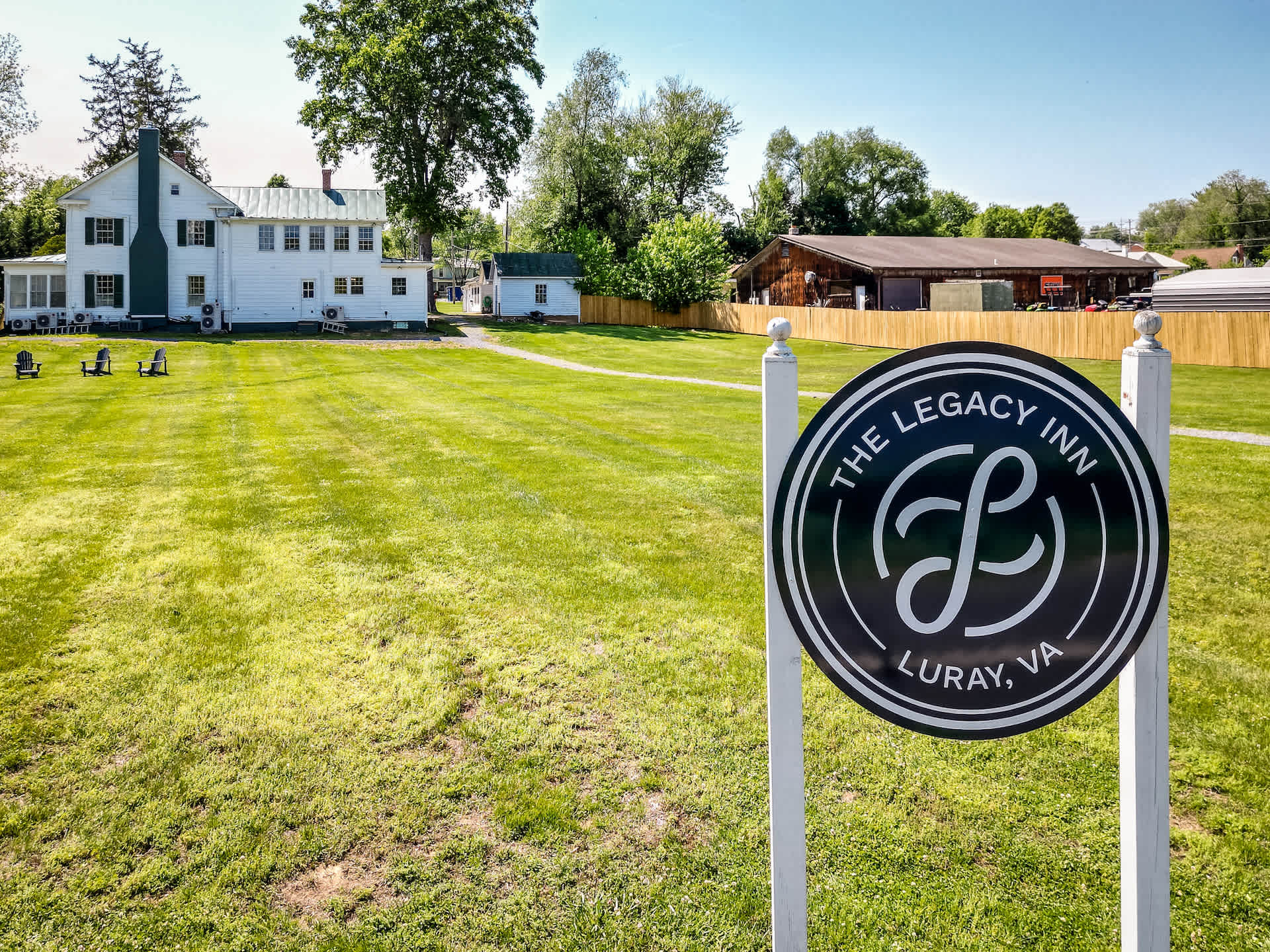 The legacy inn features a spacious lawn with seating areas for outdoor relaxation.