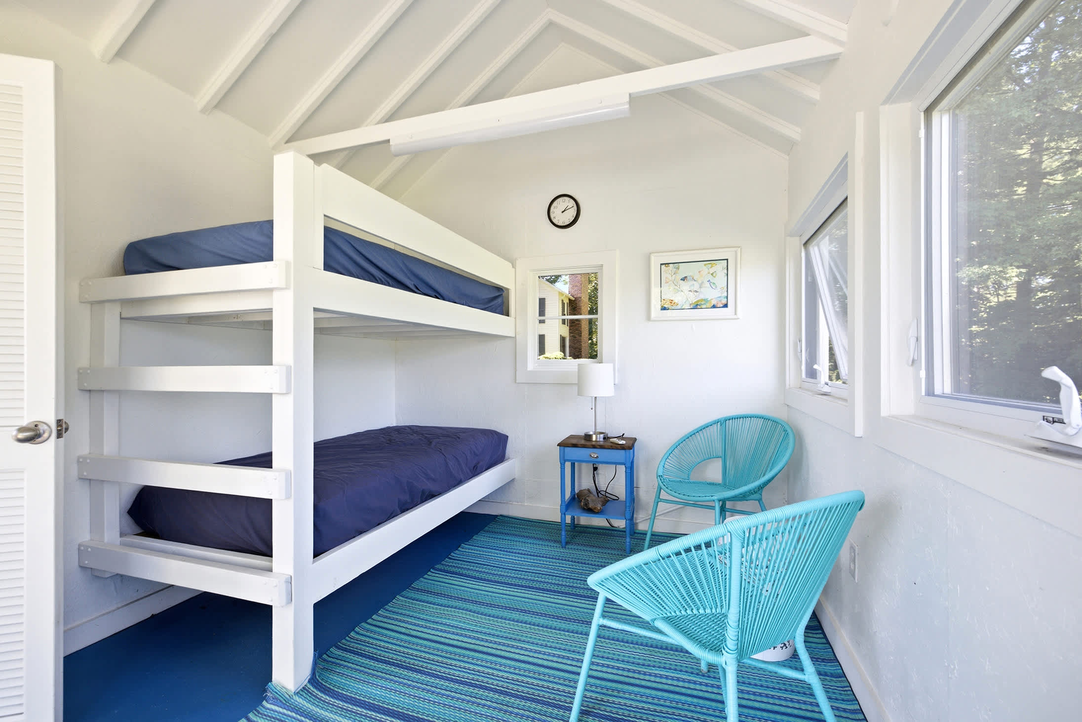 Sunlit bunks in the poolhouse made for lazy summer sleepovers.