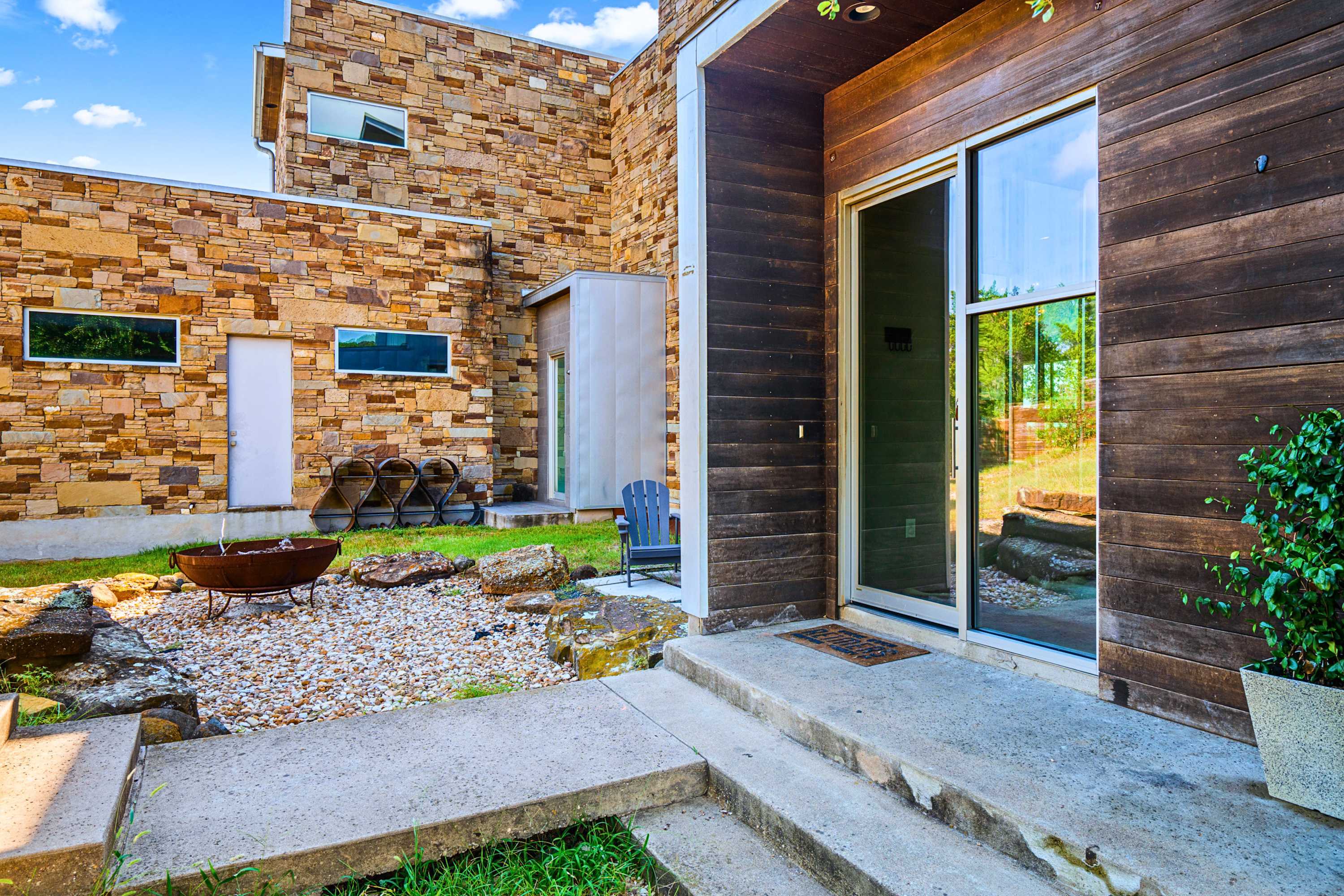 Main: Architectural beauty greets you at the entry of this striking modern estate.