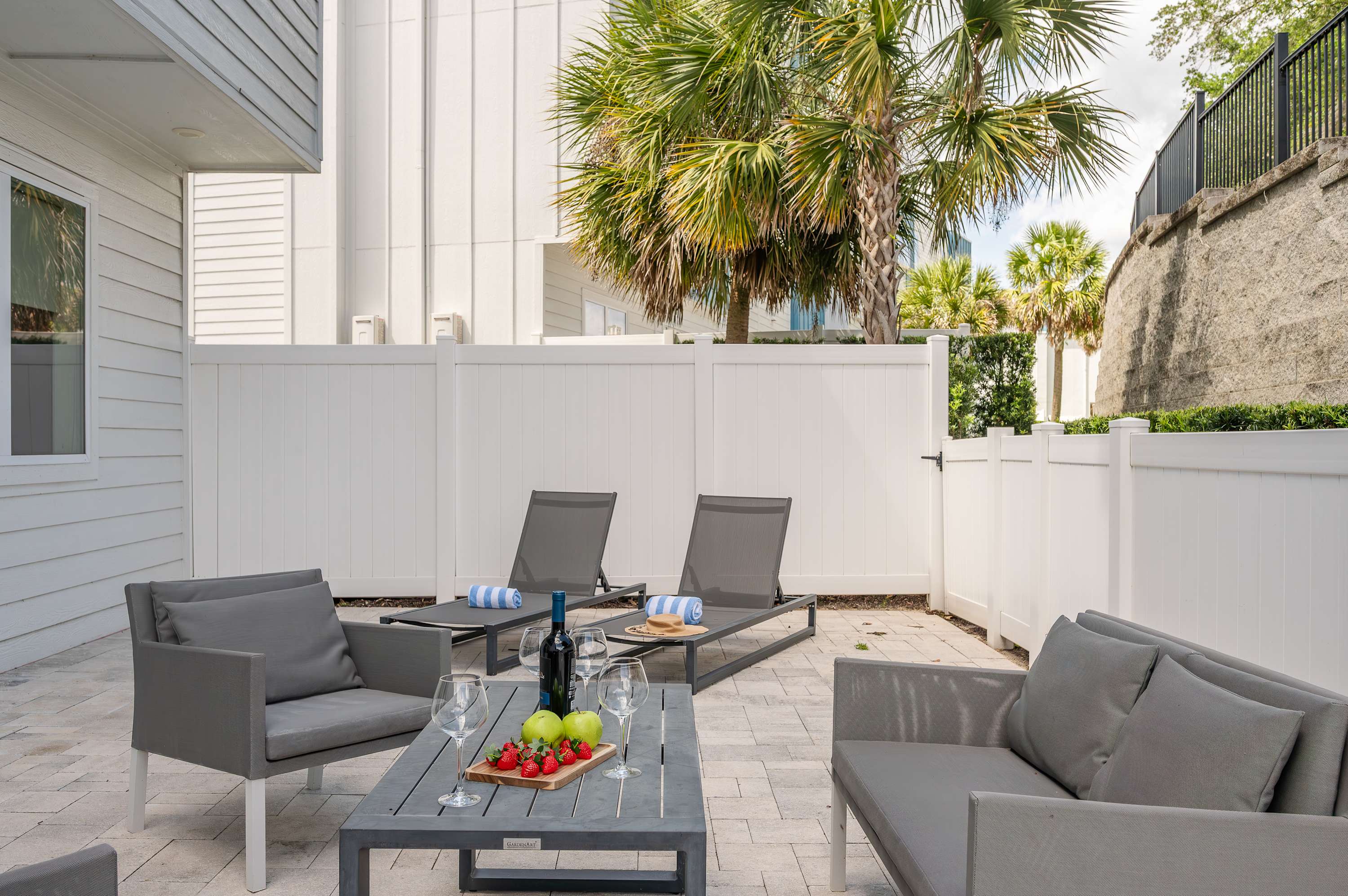 Relax in the modern outdoor patio with comfortable seating and lounge chairs.
