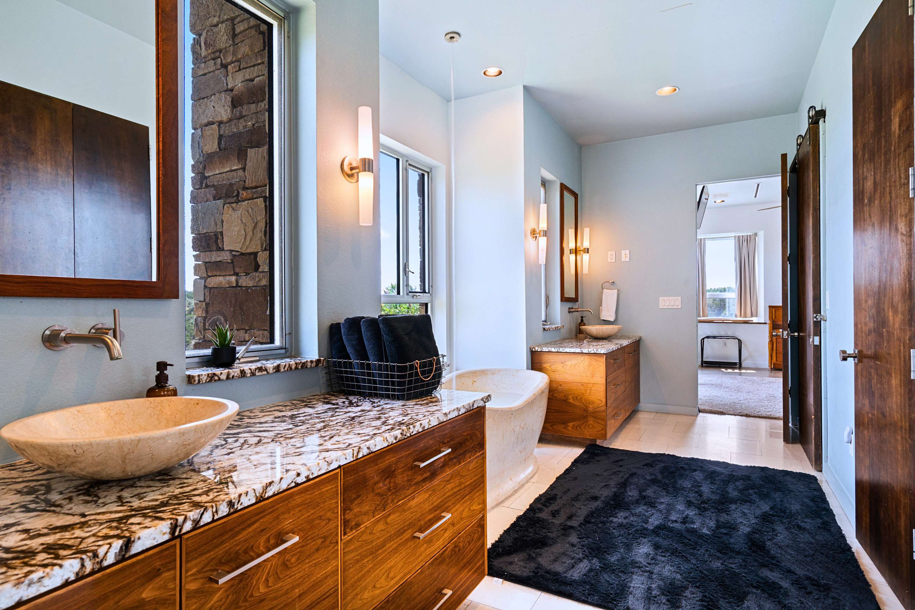 Main: A luxury double vanity and ample counter space make morning prep a breeze.