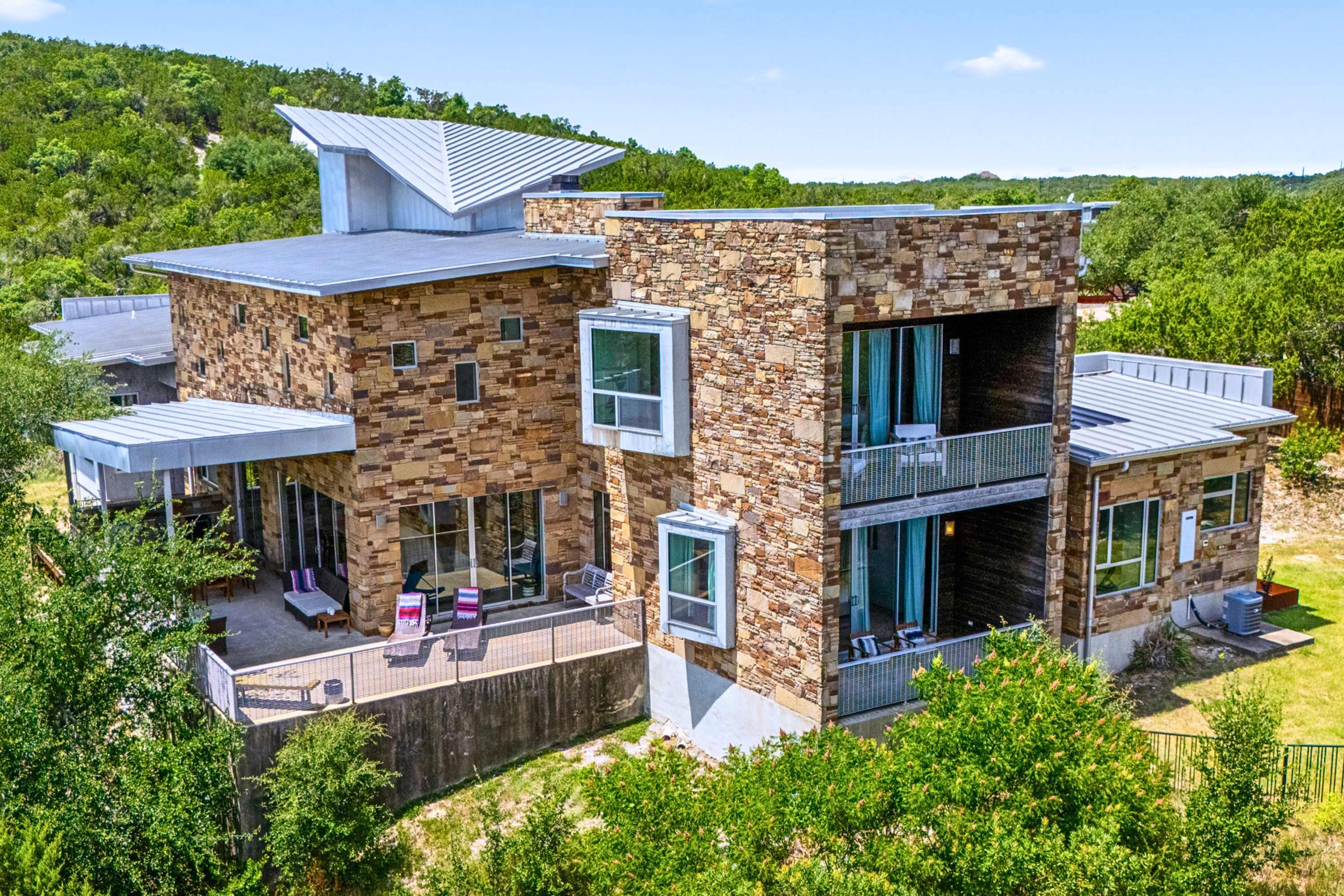 Stunning modern stone estate offering ultimate privacy and luxury group living.