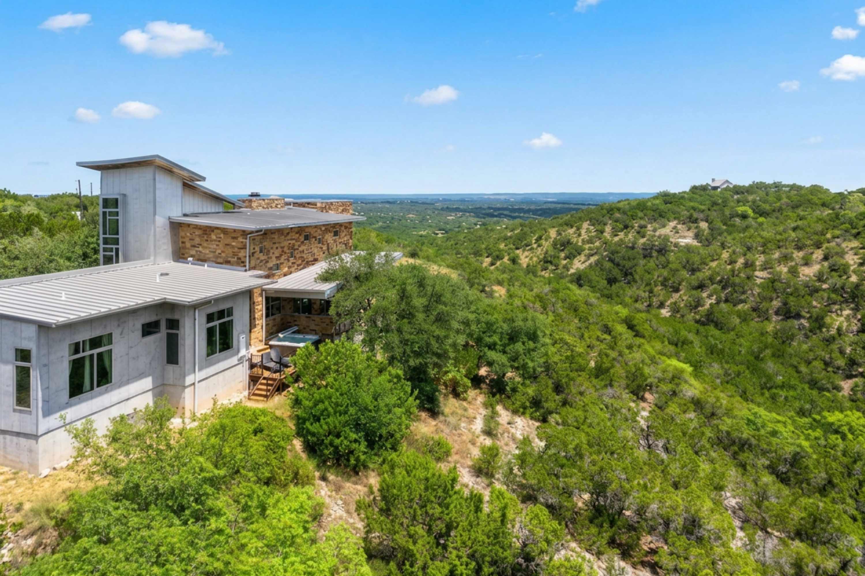 Stunning modern architecture beautifully tucked into the rolling green hillside.