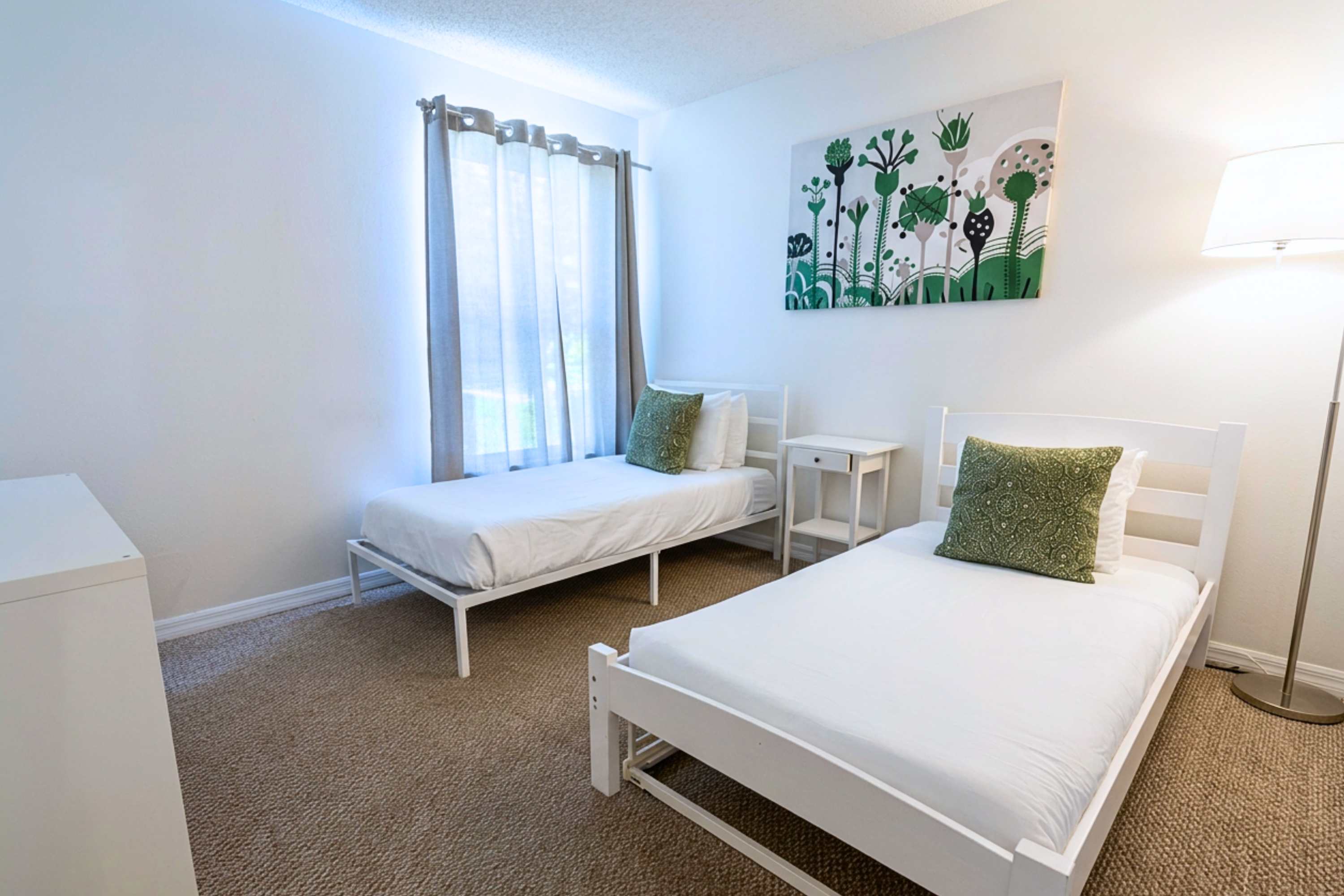 Two twin beds with cozy bedding for a comfortable stay