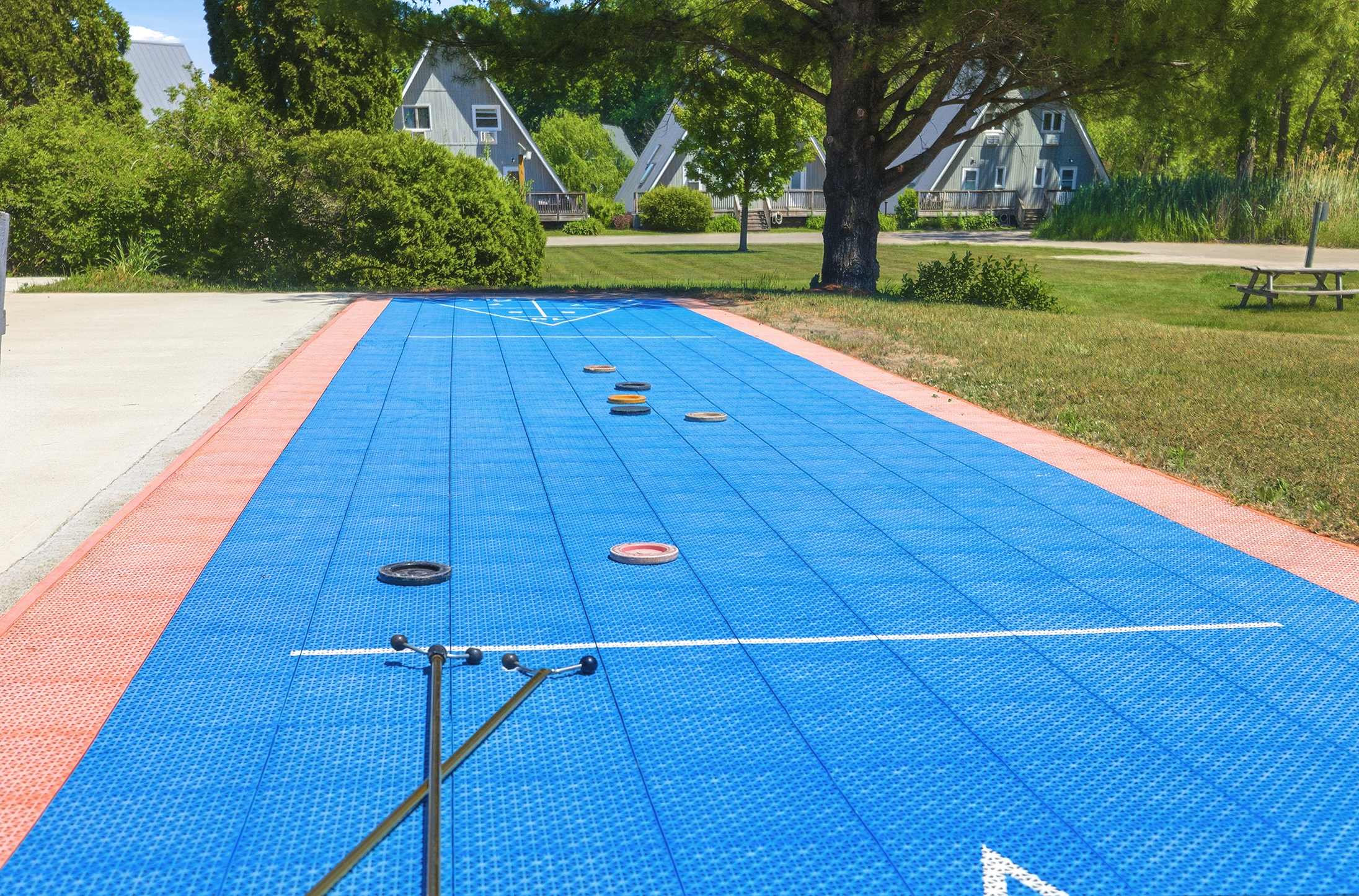Lazy chalet days with shuffleboard, sunshine, and open-air lounging.
