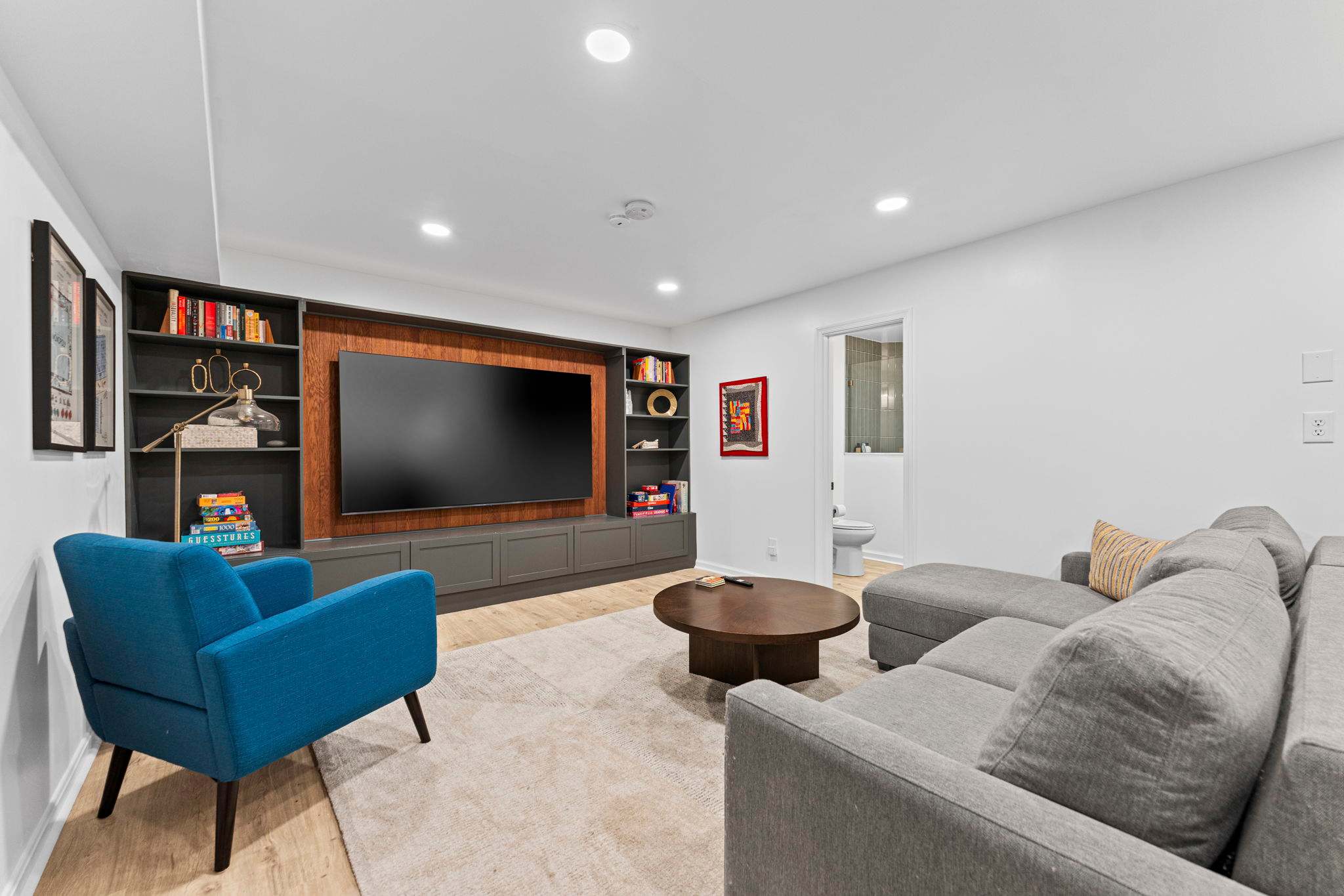 Theater-style basement with 95" TV