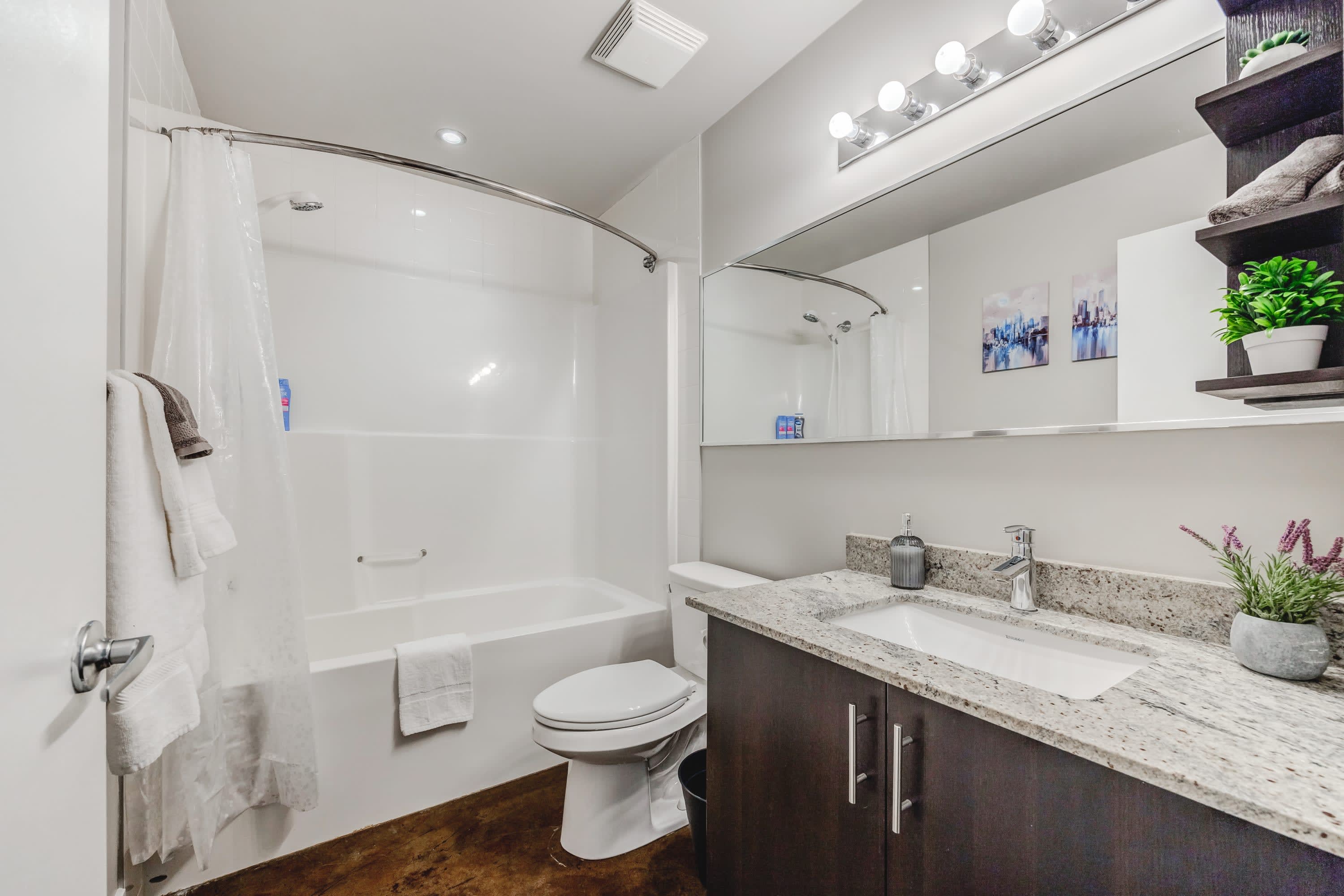 Clean And Bright Bathroom With Full Bathtub