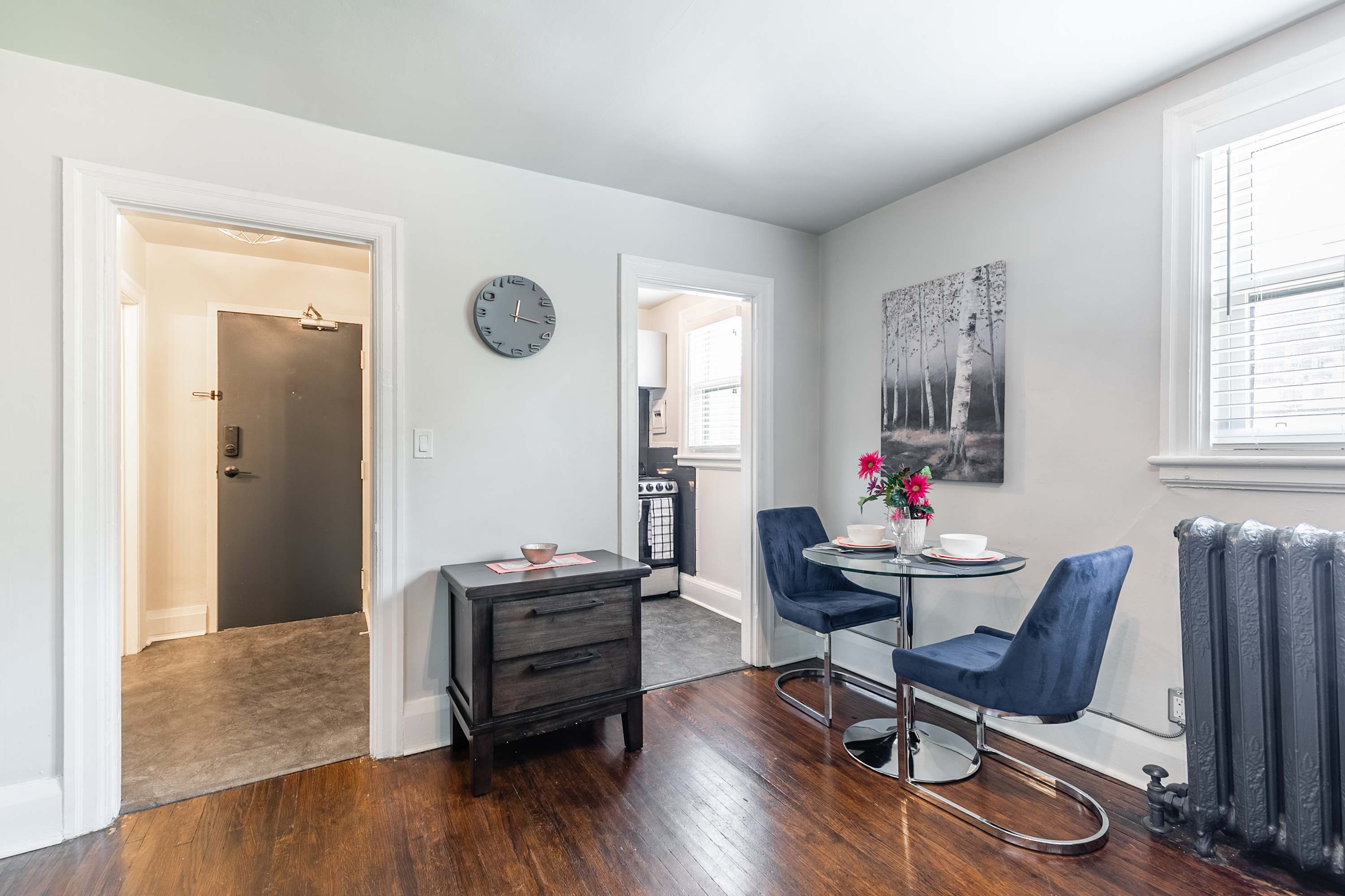 A sleek table with velvet seating for morning coffee and private meals.