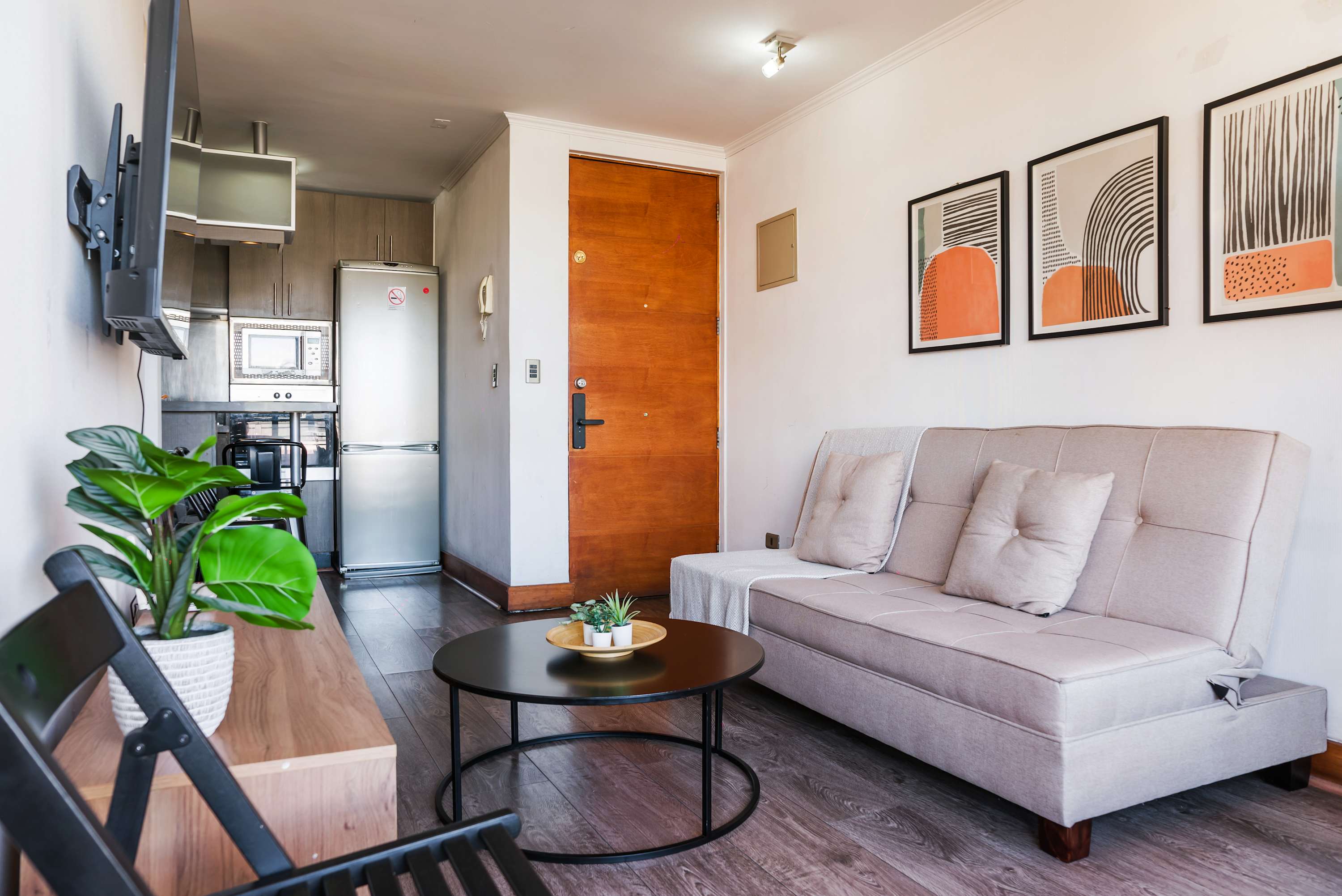 Modern living space with stylish decor and a functional kitchen, ideal for unwinding after city adventures.