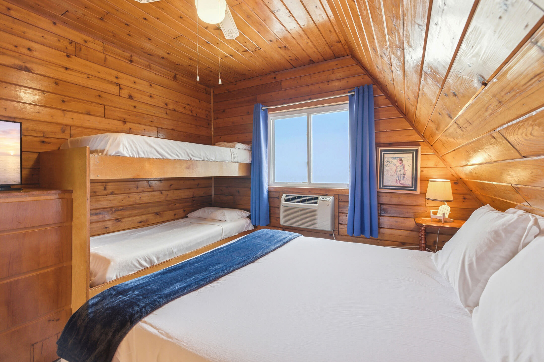 Designed for family vacations, this bedroom offers room for multiple guests.