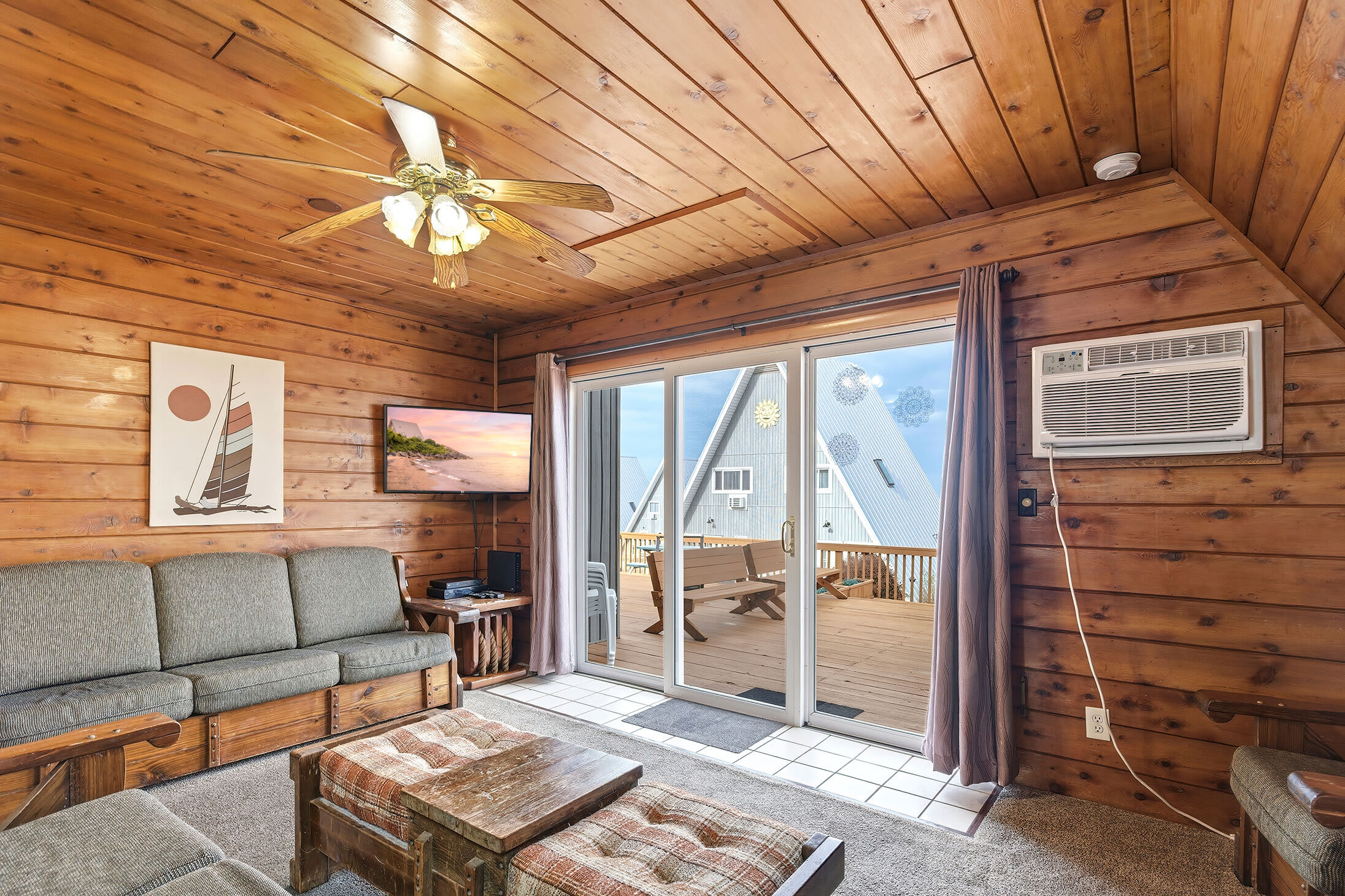 Airy living room with deck access near Lake Michigan shoreline.