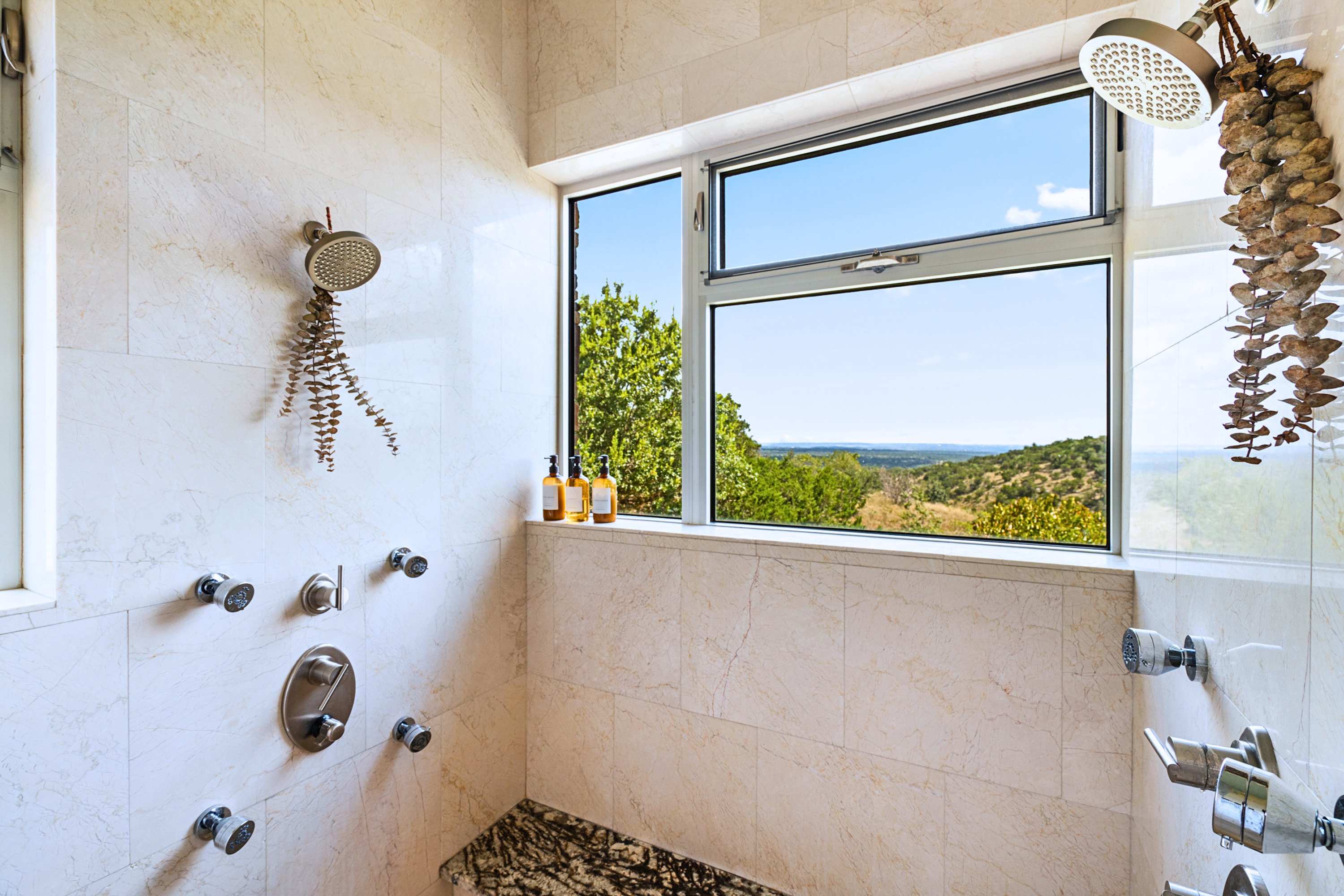 Bright and beautifully tiled walk-in shower designed for pure relaxation