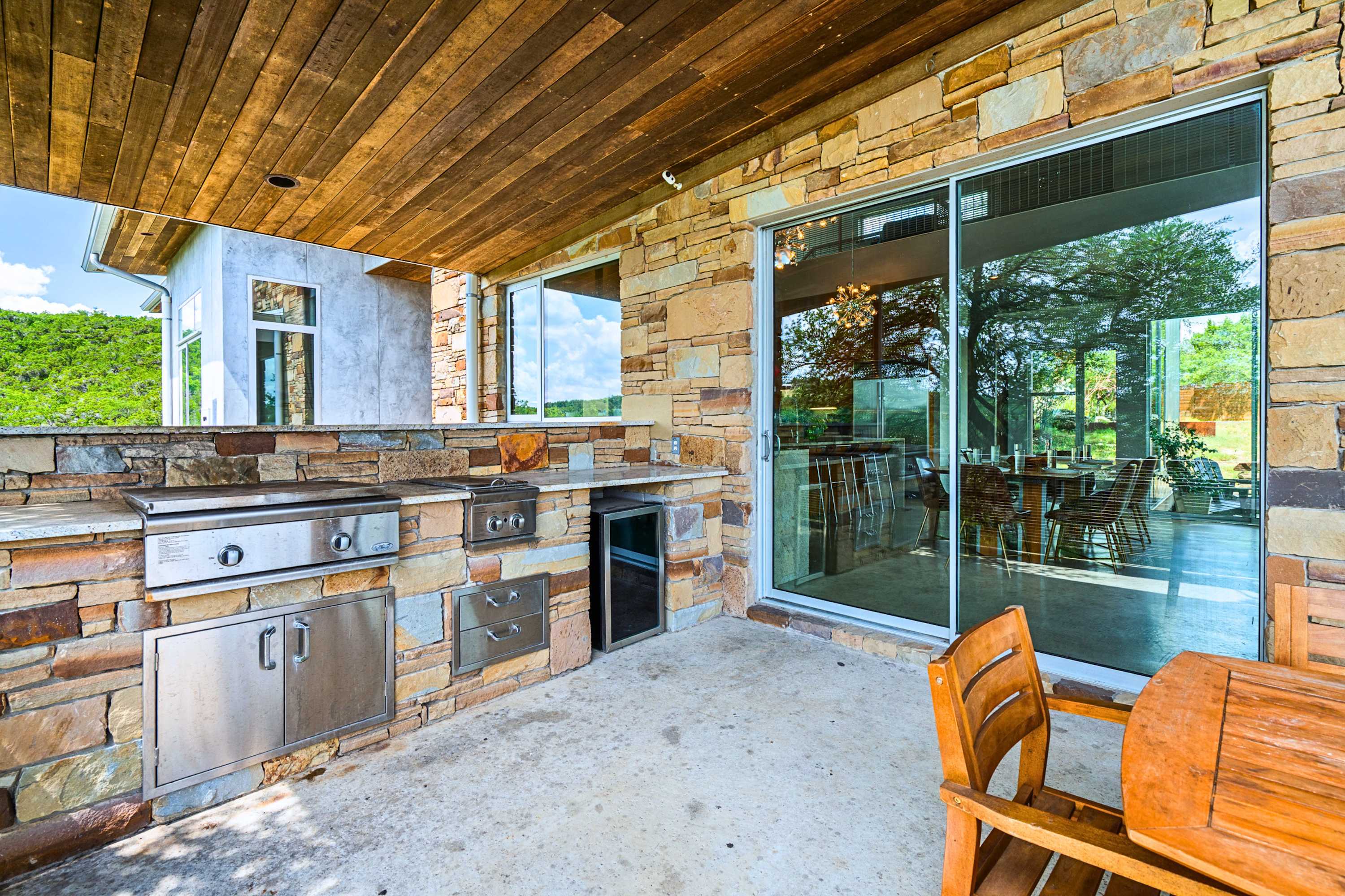 Grill and dine outdoors with scenic Hill Country views