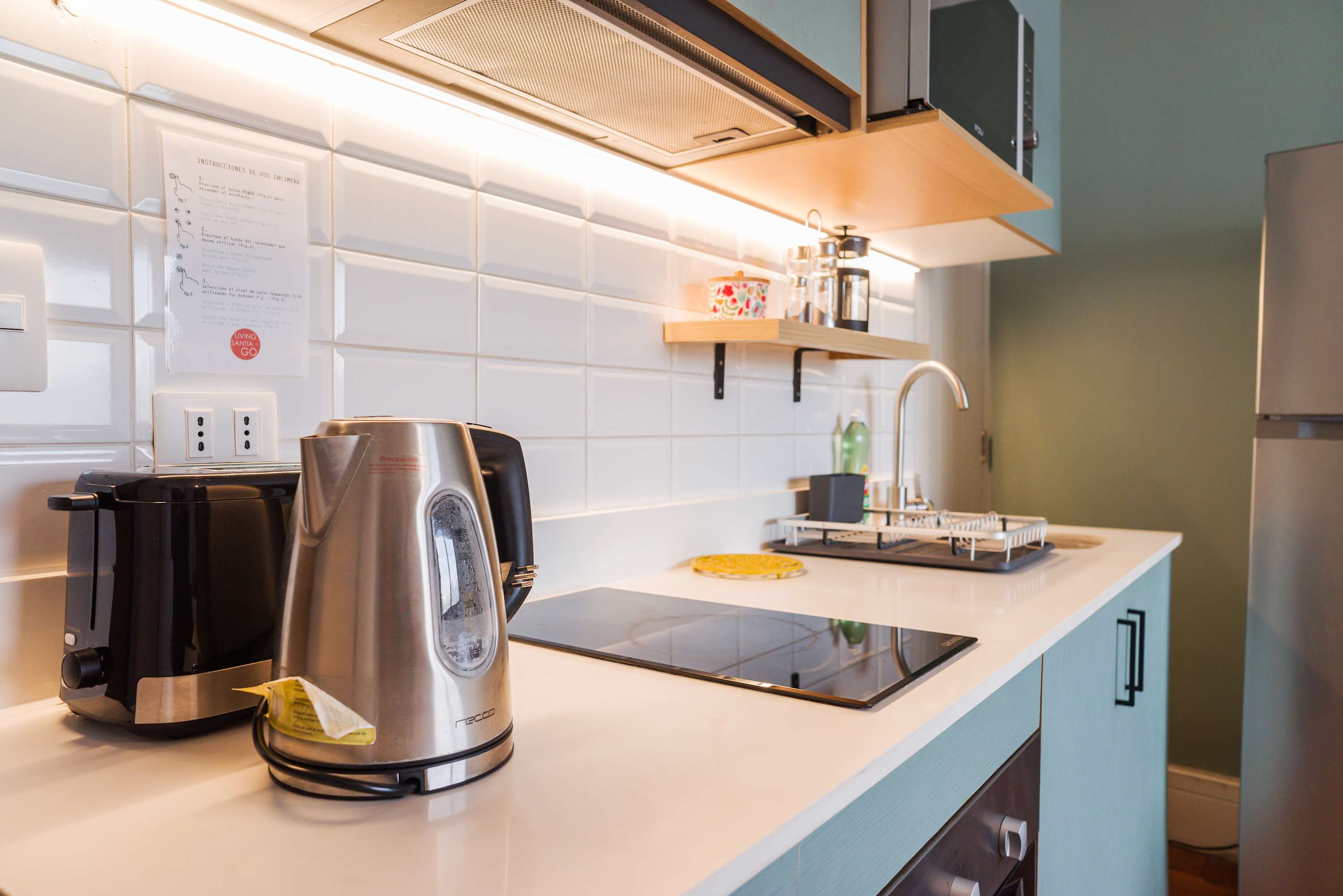 Sleek and modern kitchen with all essentials for a comfortable stay in the heart of the city.