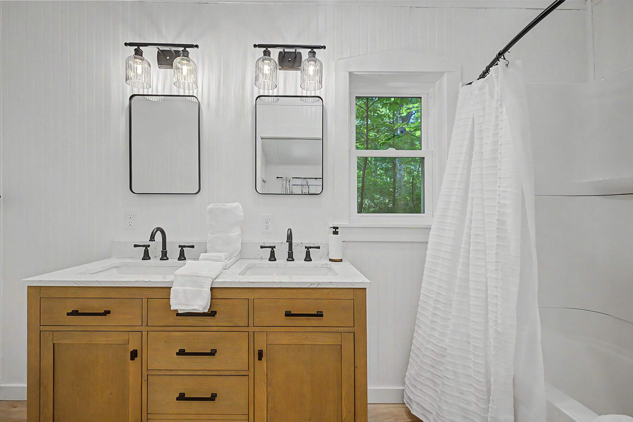 Ensuite bath with double vanity simplifies busy mornings.