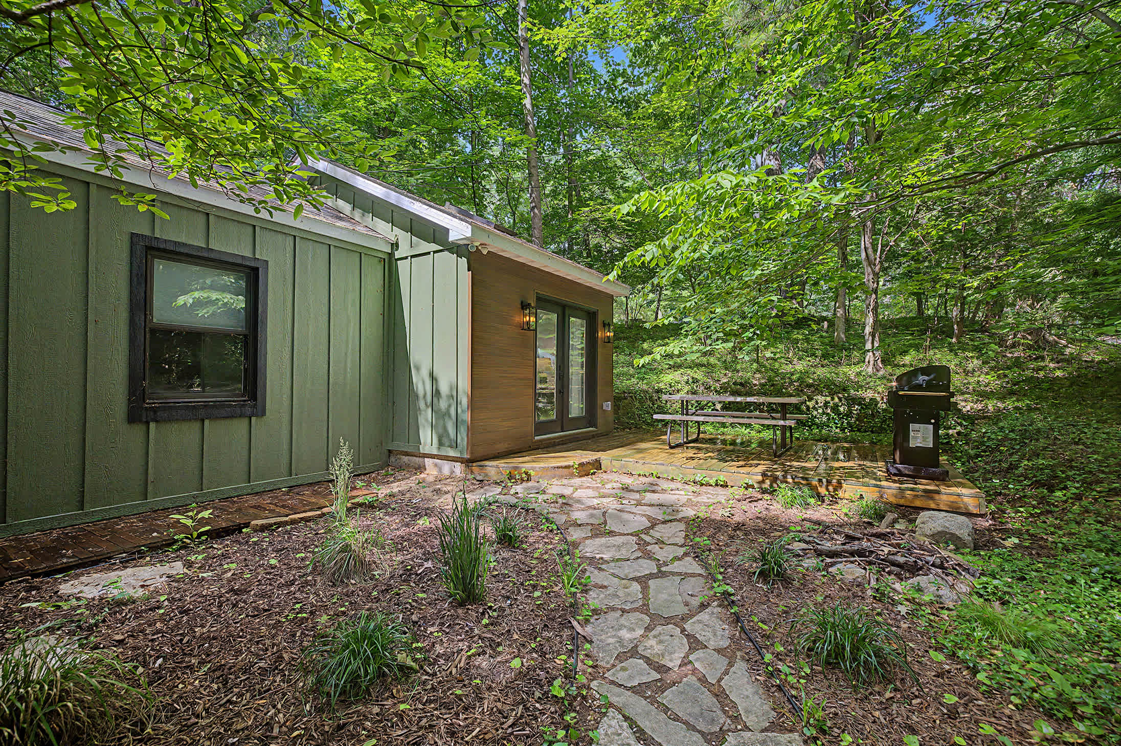 Private outdoor dining and grilling in the heart of Harbert.