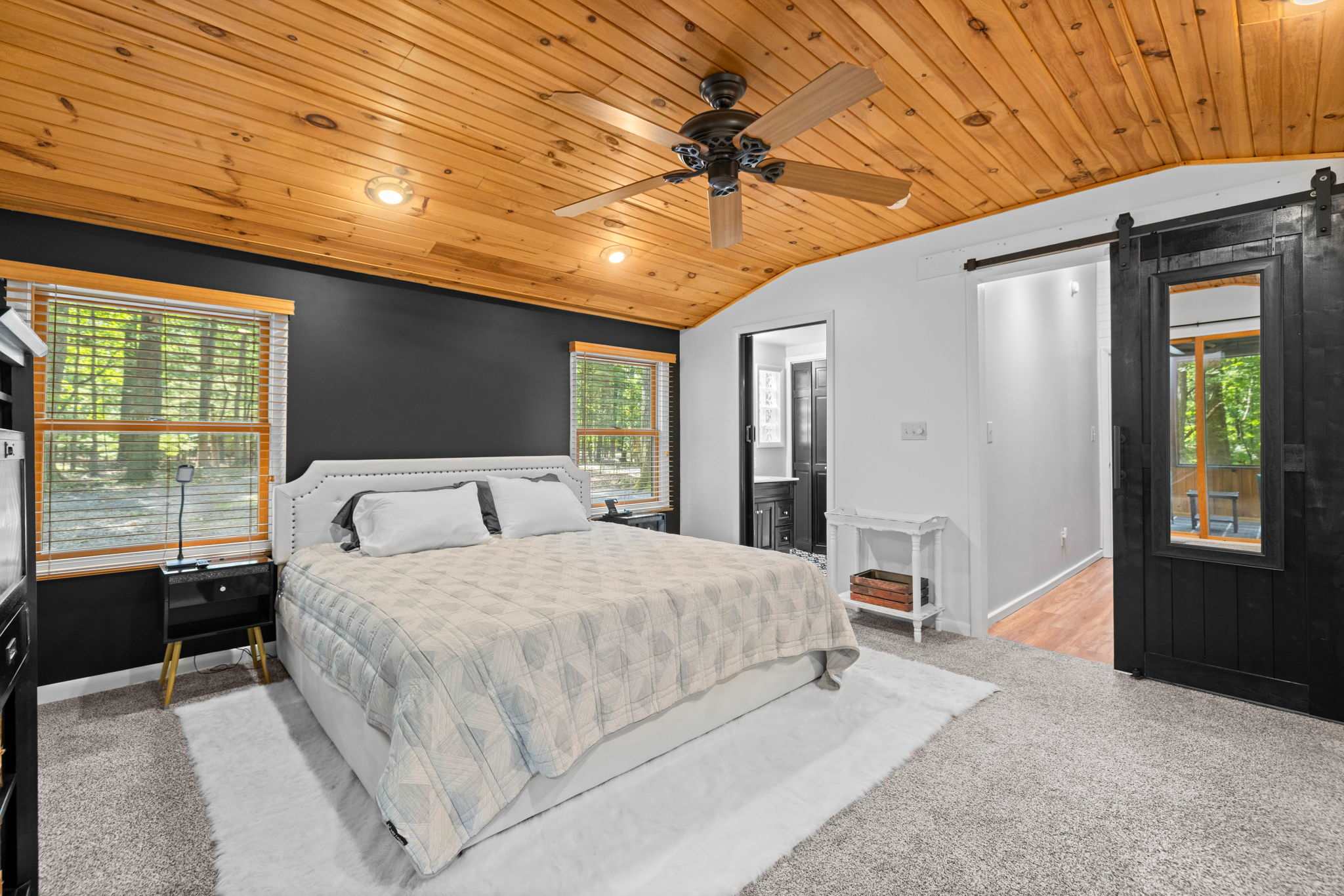 Primary Bedroom (main level): King bed w/Smart TV, Ceiling fan & Private ensuite bathroom with walk-in shower