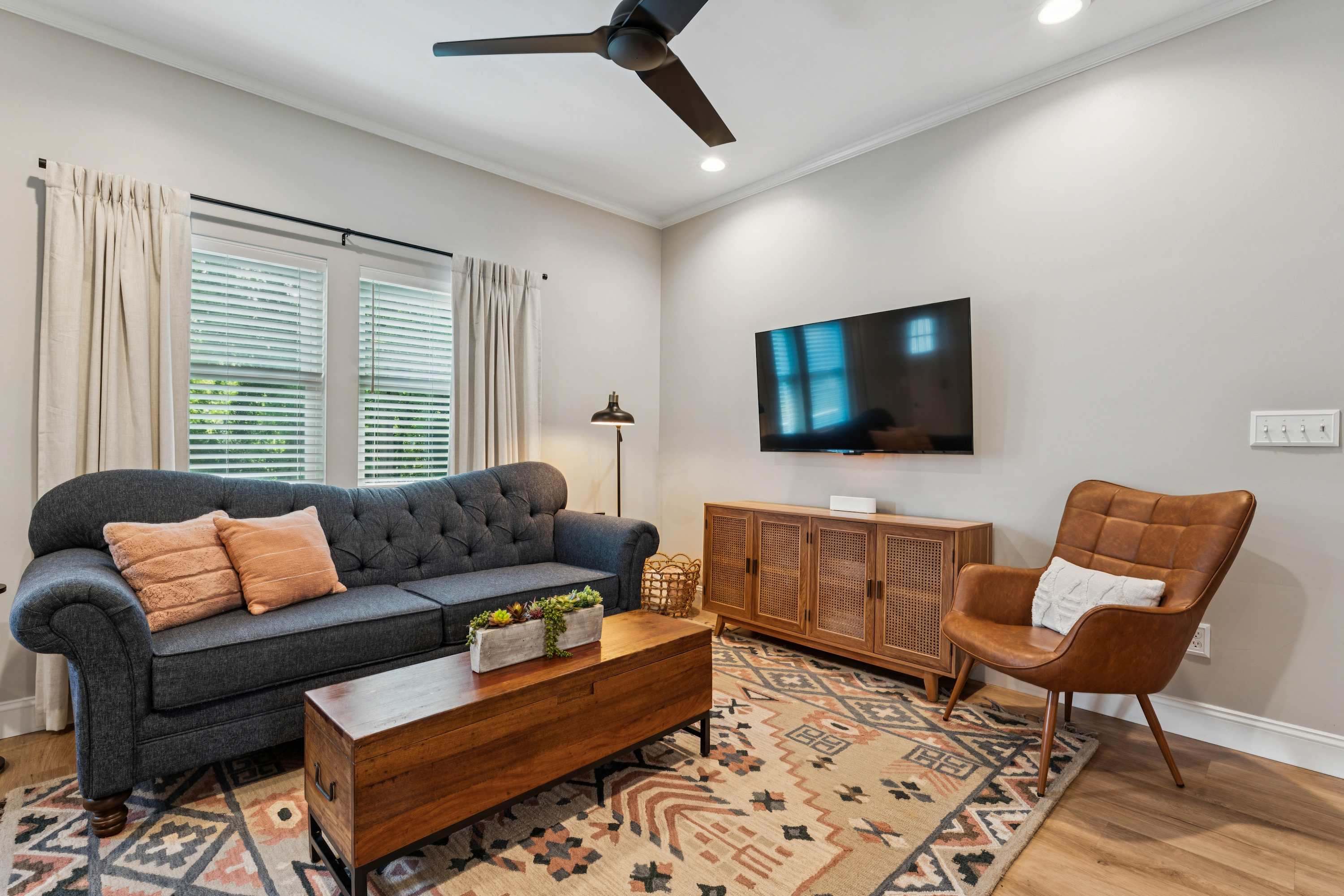 Unwind in the inviting living room & stream your favorites on the smart TV​