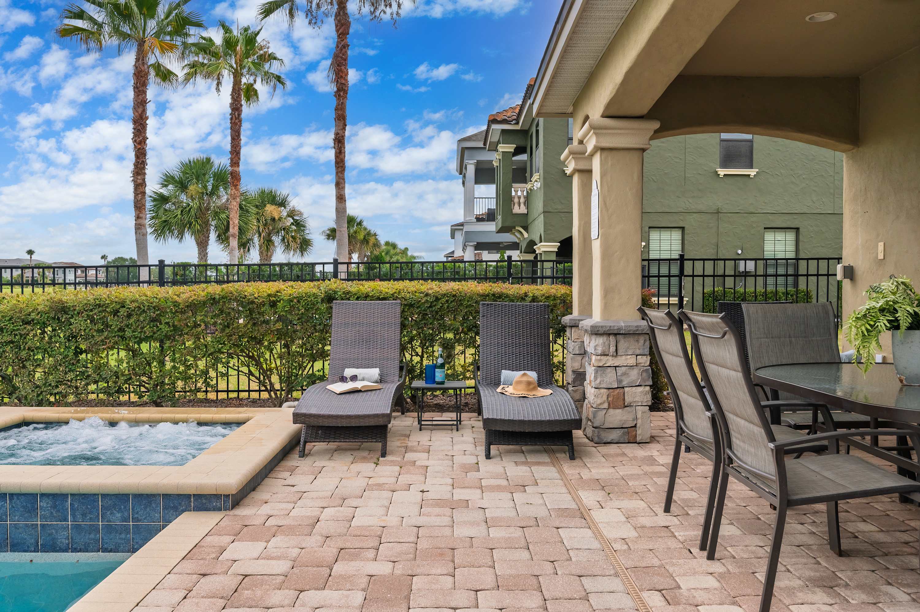 Relax by the pool and enjoy the covered patio with outdoor dining and lounge chairs.