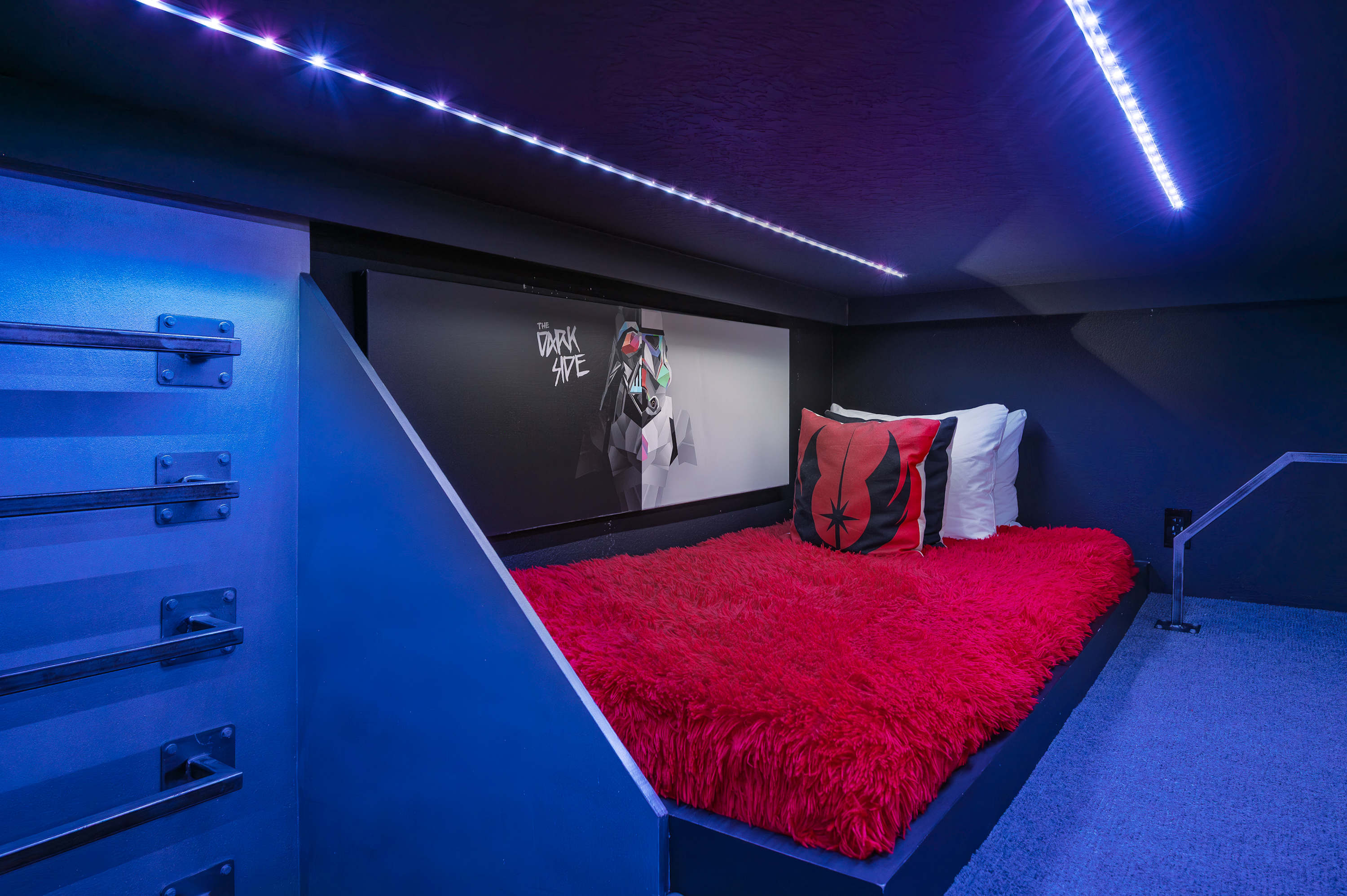 Cozy sleeping nook with themed decor and ambient LED lighting