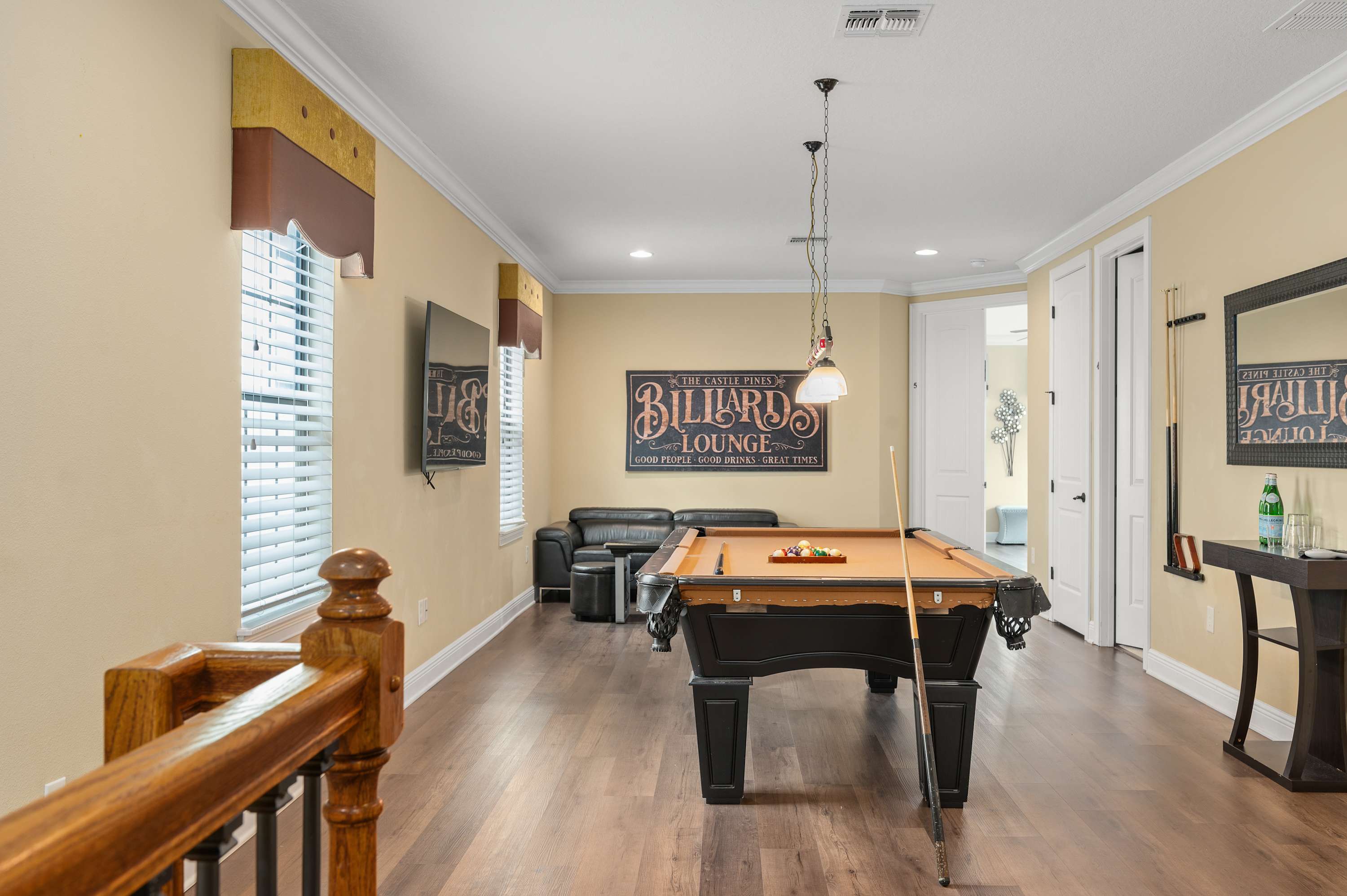 Recreation room featuring a pool table and seating area for relaxing and socializing.
