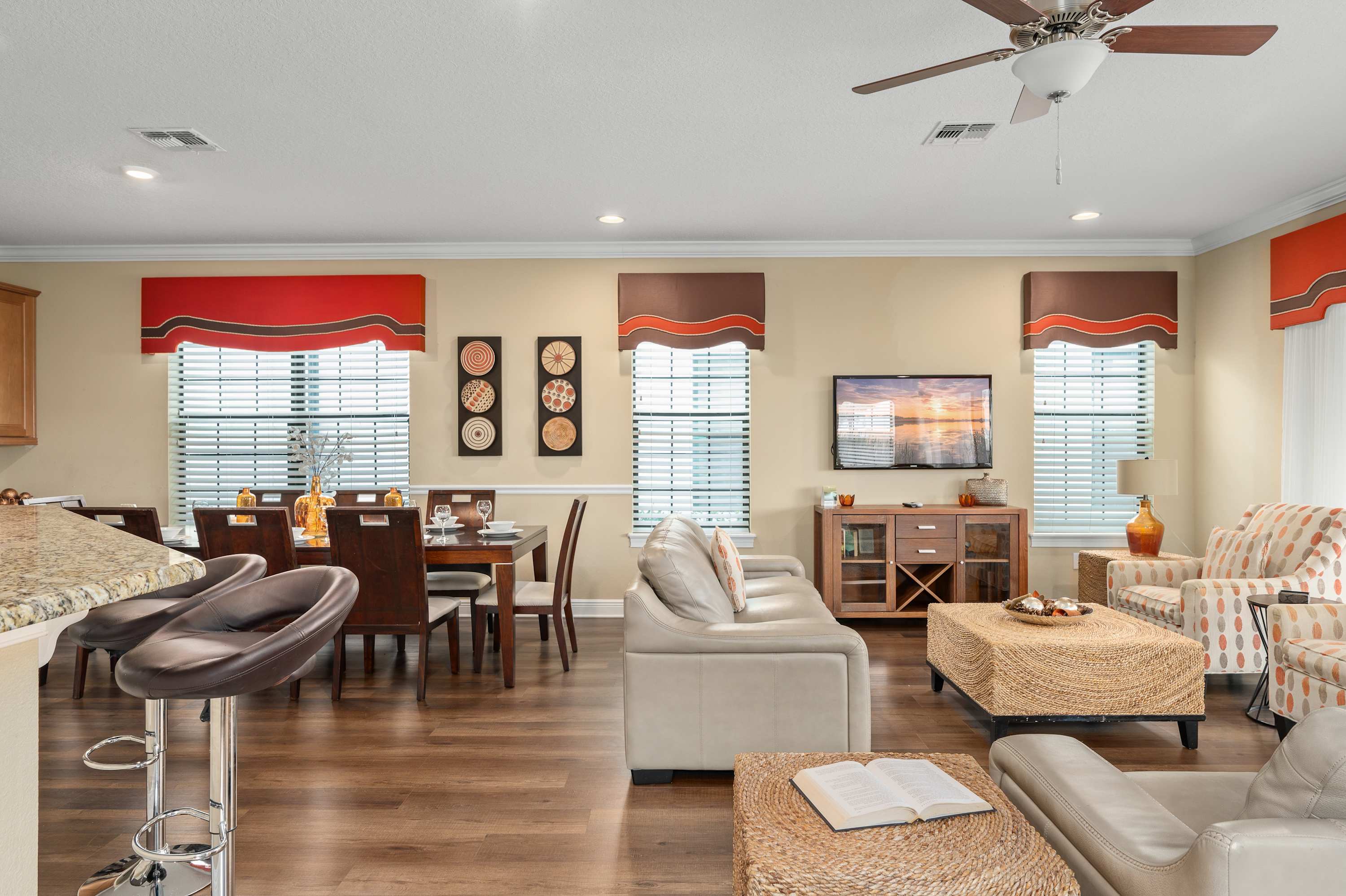 Open-concept living and dining area with modern furnishings and natural light.