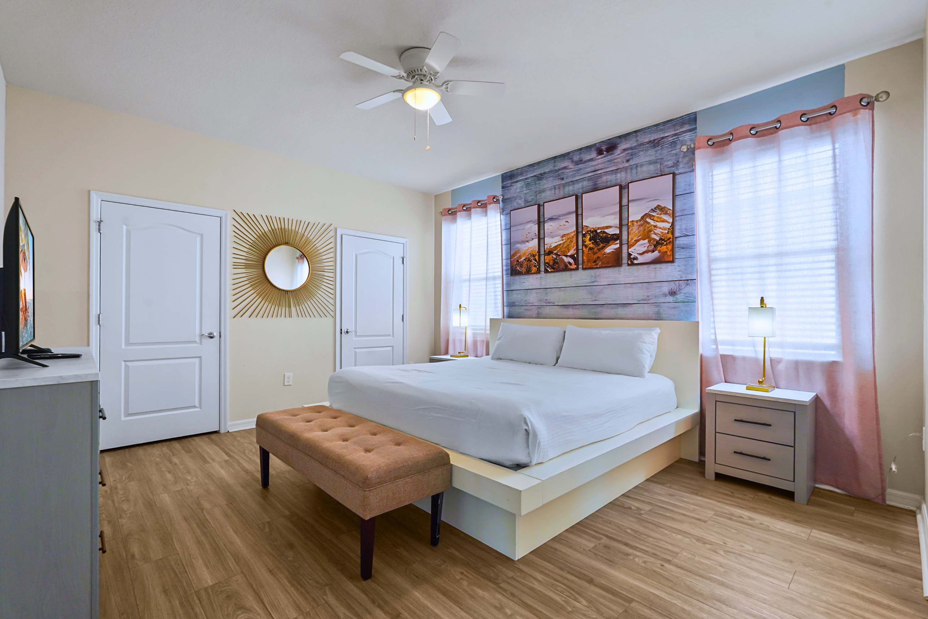 Unwind in style! A bright bedroom showcasing modern beachy accents and premium linens.