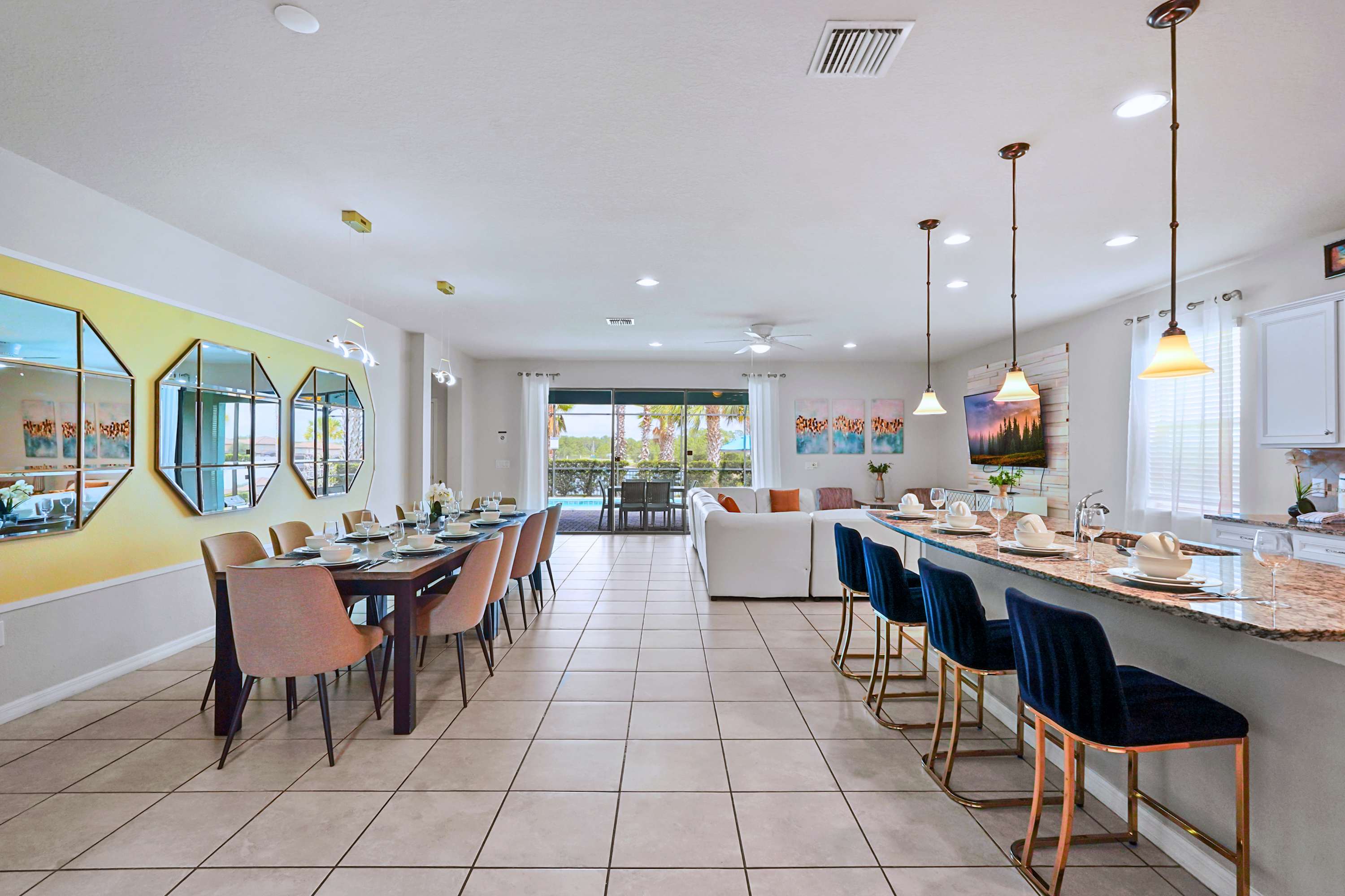 Bright, sun-drenched interiors that seamlessly connect the indoor lounge to the pool deck.