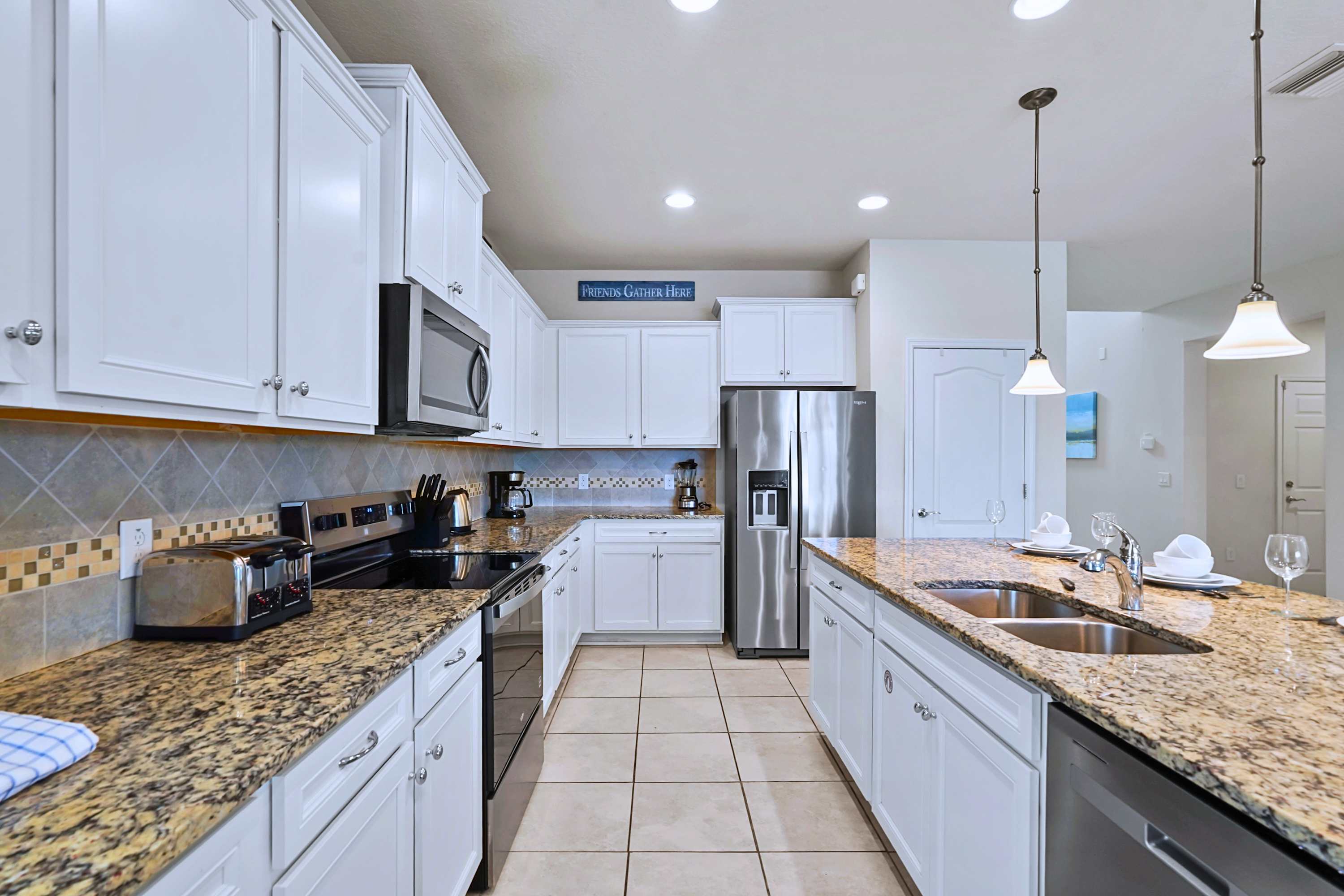 Premium stainless appliances and a generous granite countertop.