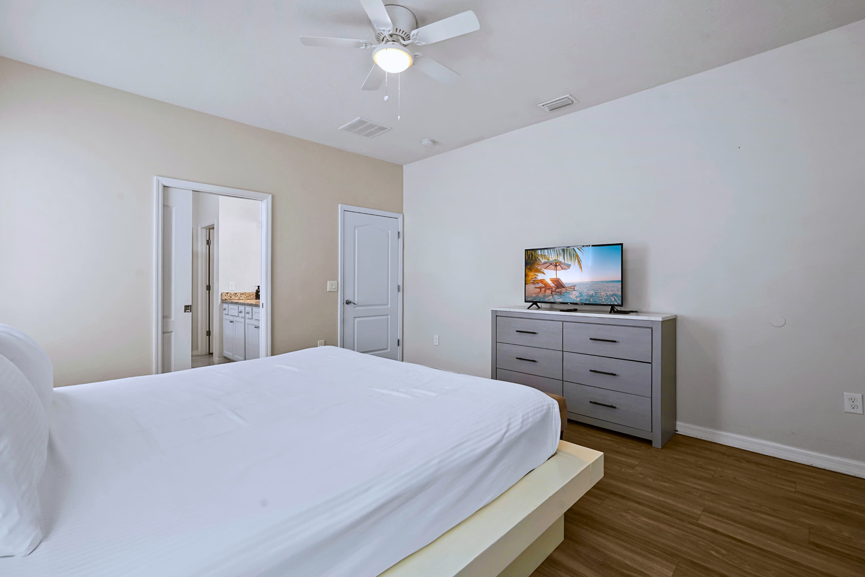 Seamless layouts and beautiful hard floors make this guest suite a peaceful oasis.