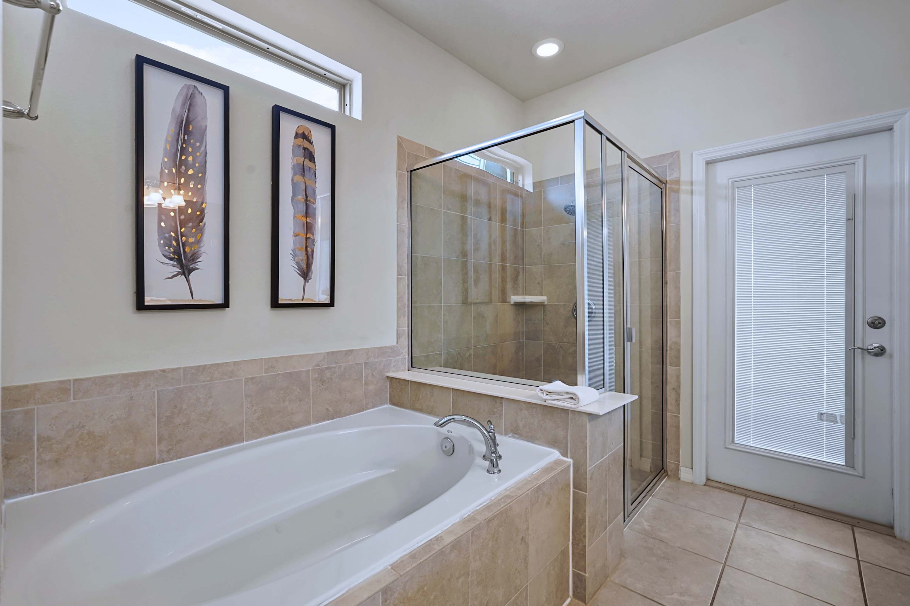 Melt your worries away in a deep soaking tub right alongside a pristine glass shower.