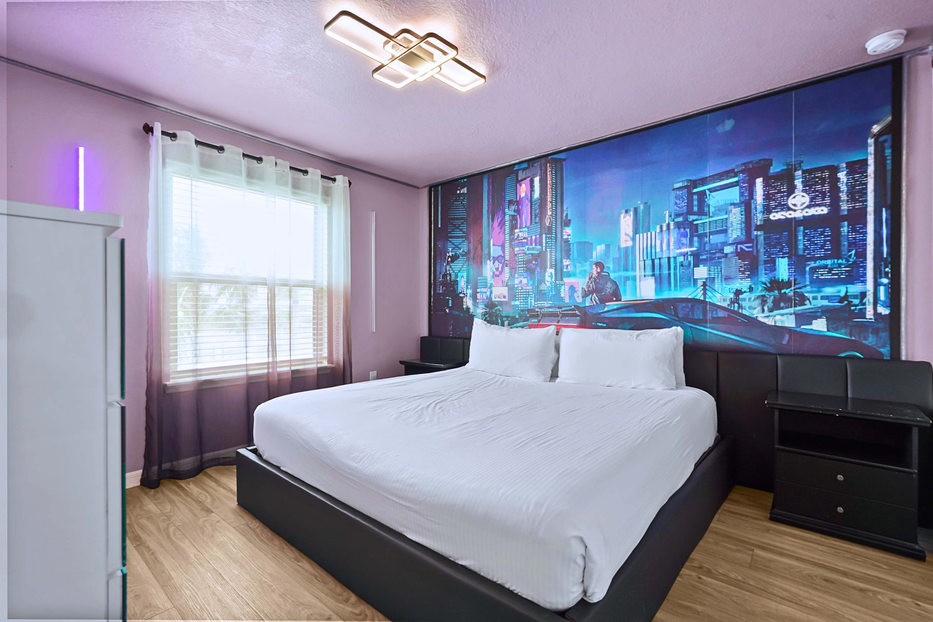 High-tech style! This unique cyberpunk city mural creates an epic themed sleeping experience.