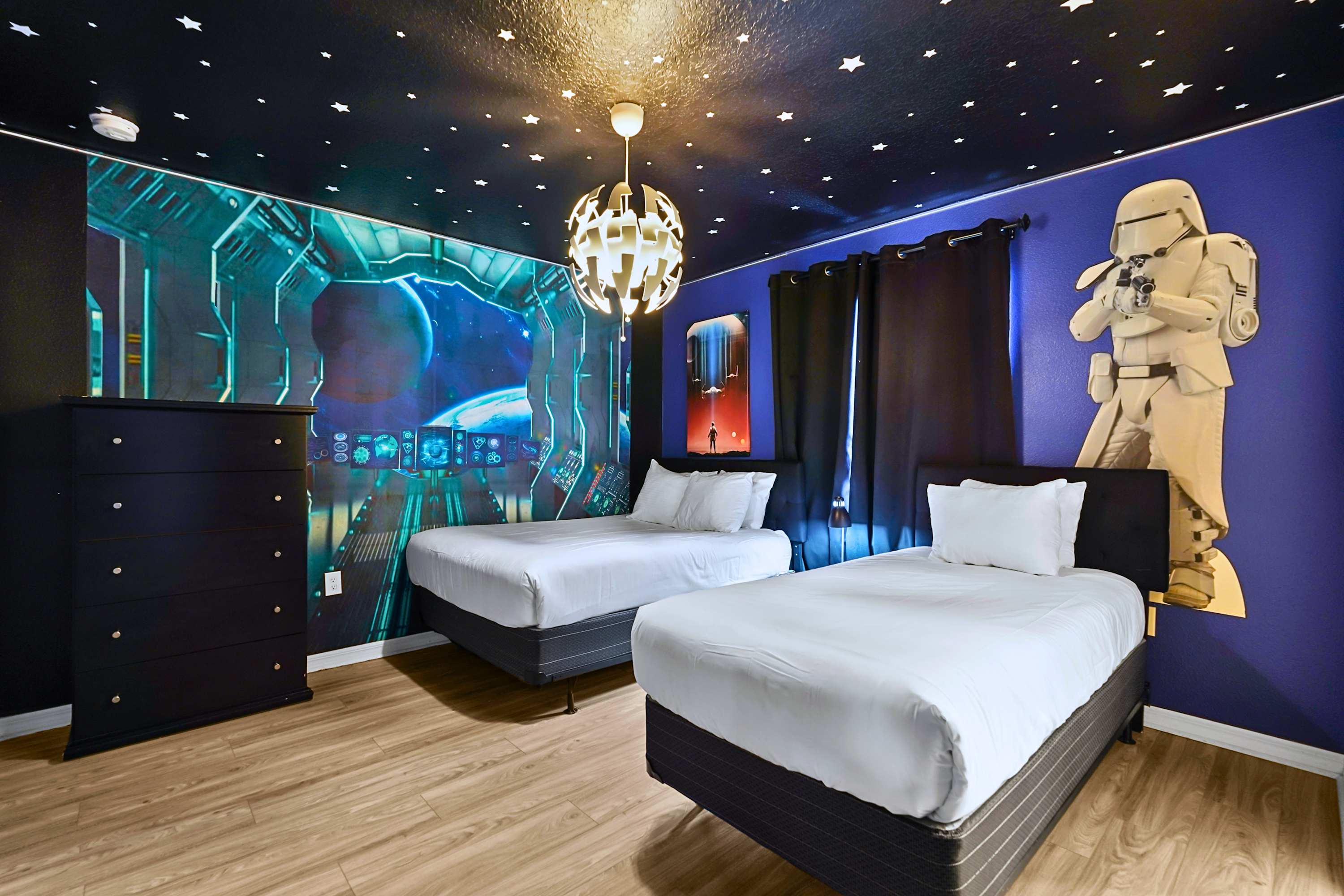Out of this world! An epic space-themed bedroom complete with a custom galaxy ceiling.