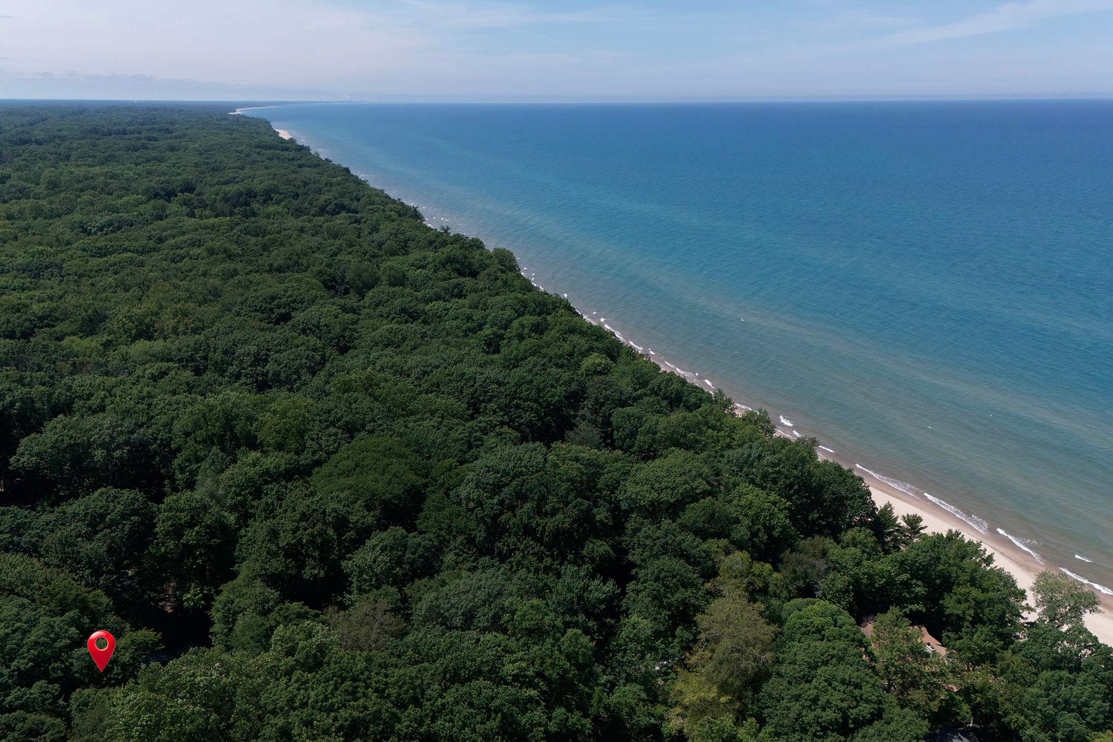 Wide sandy shoreline and Lake Michigan views await nearby at Harbert Beach.