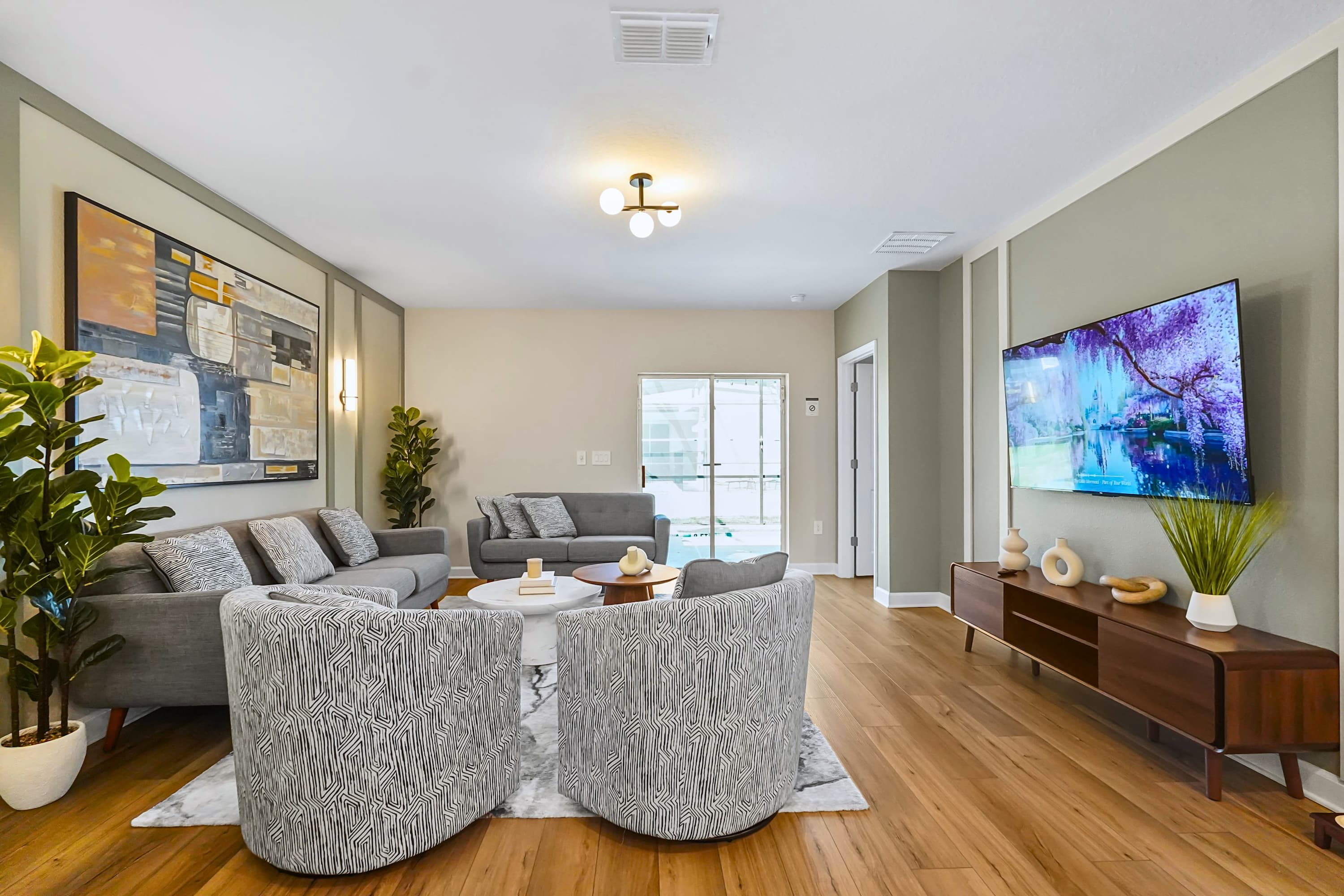 Spacious lounge a rea for 8 with TV, ideal for group bonding and relaxed entertainment
