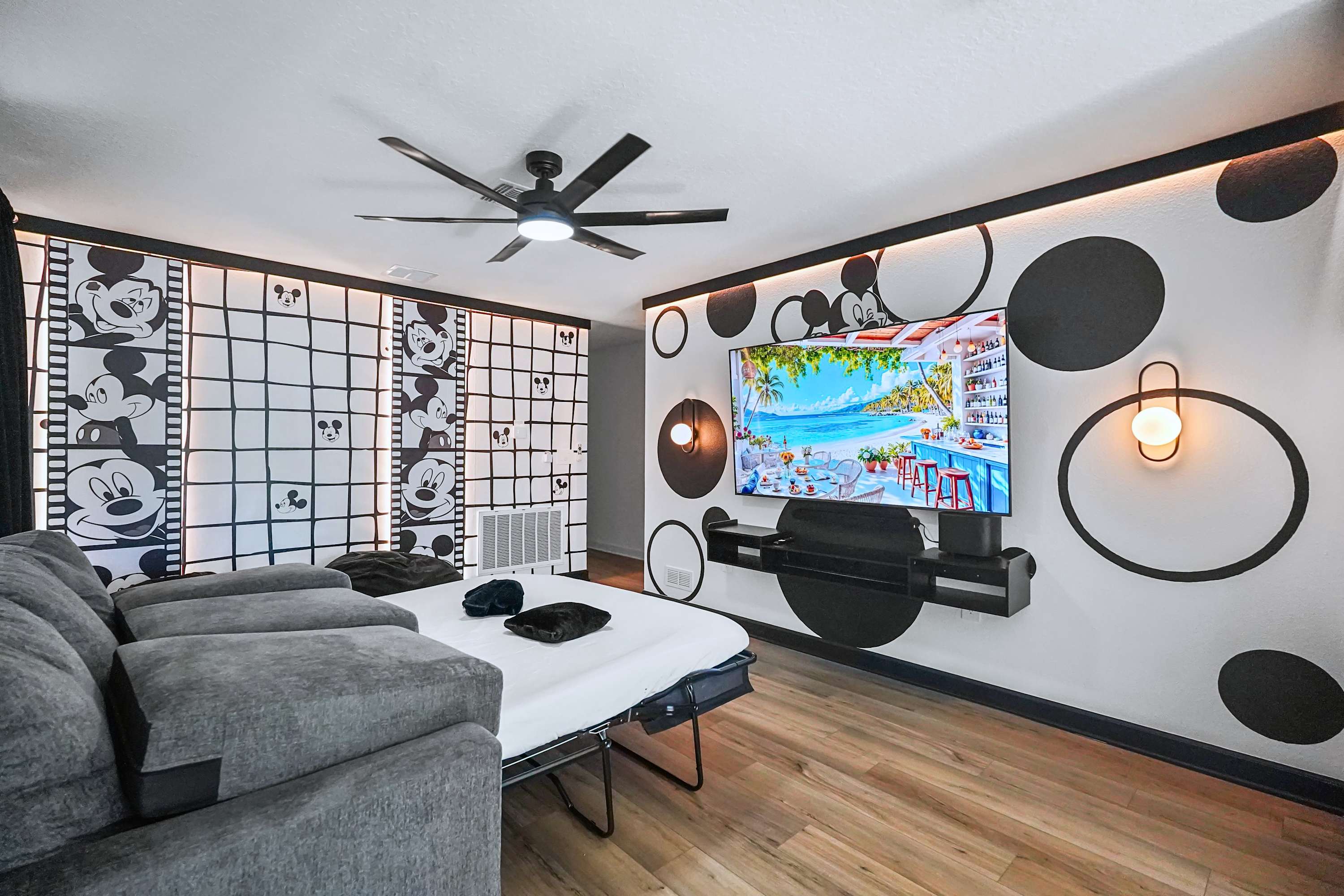 Loft seating area with a TV and plush seating, great for group hangouts and movie nights