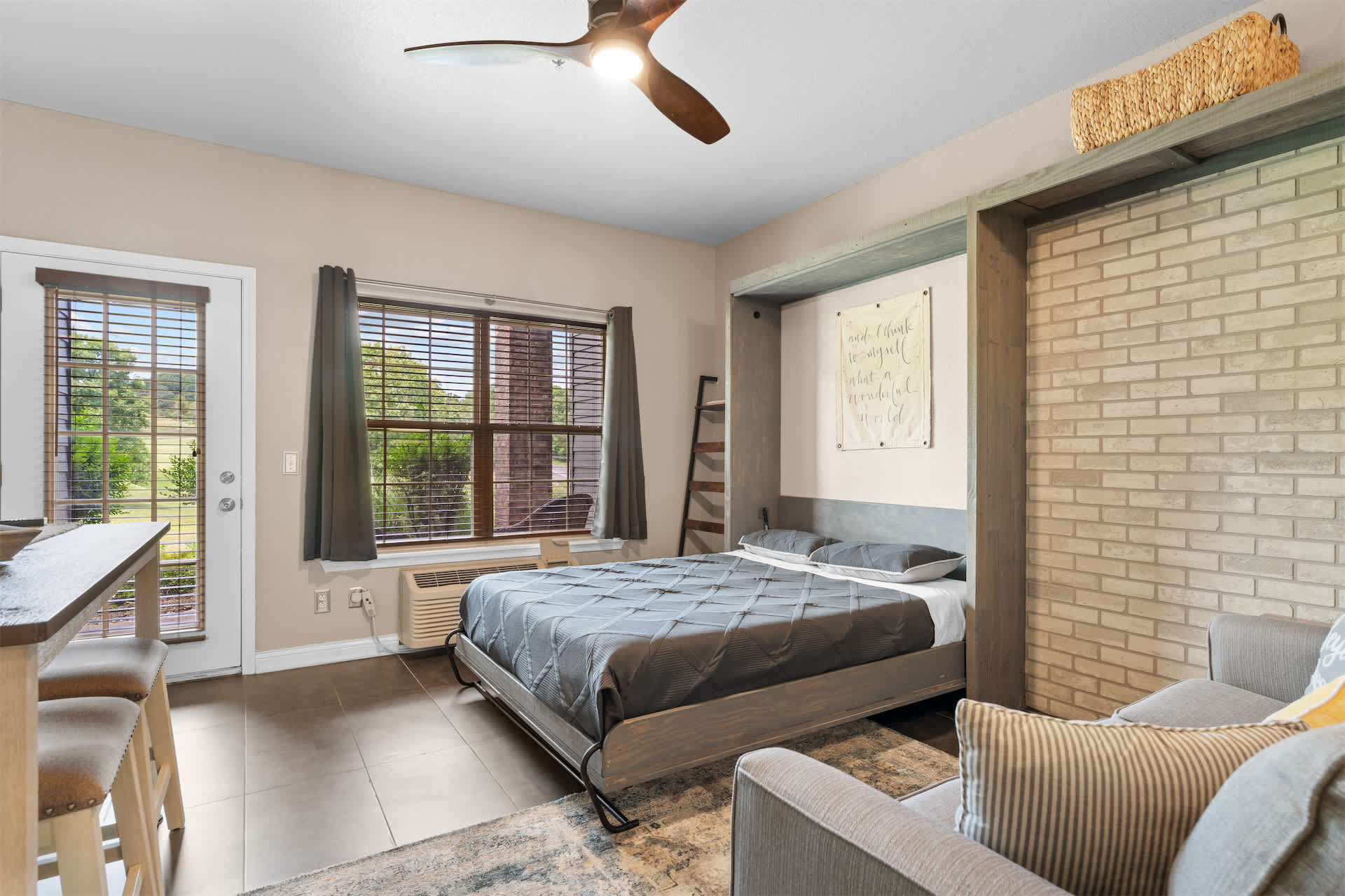 Stream your favorites on the smart TV from the queen Murphy bed or sofa sleeper ​
