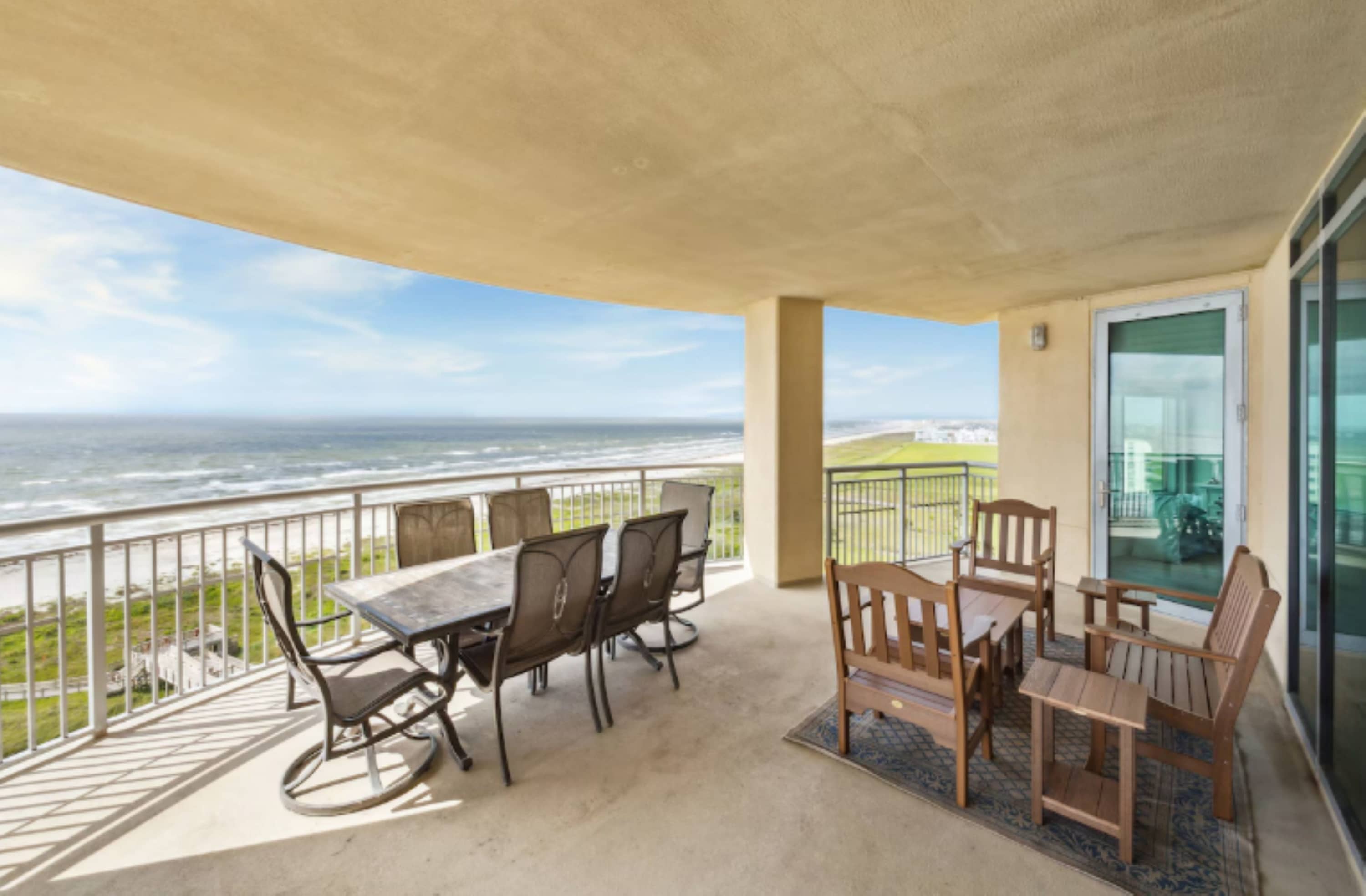Relax on the expansive covered balcony overlooking the water