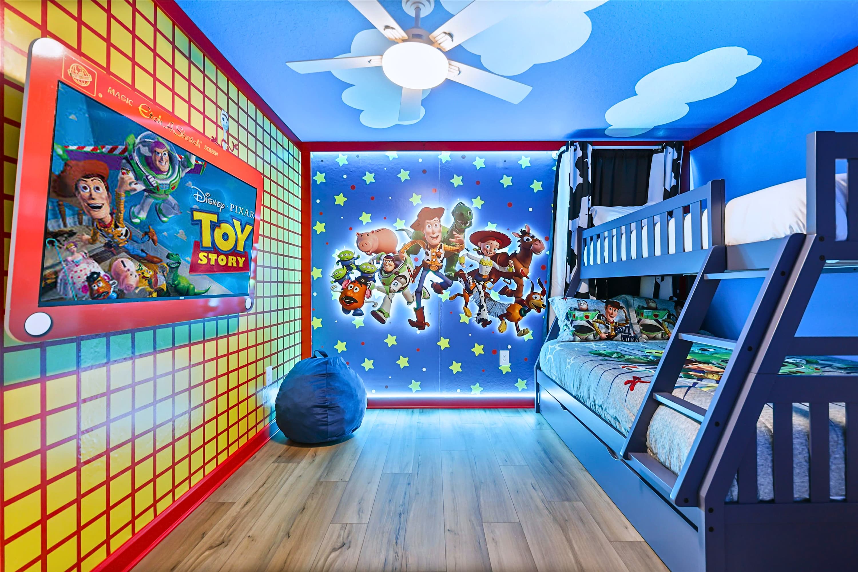 Toy Story themed children's room with bunk beds and ceiling fan, perfect for play, rest, and watching favorite shows