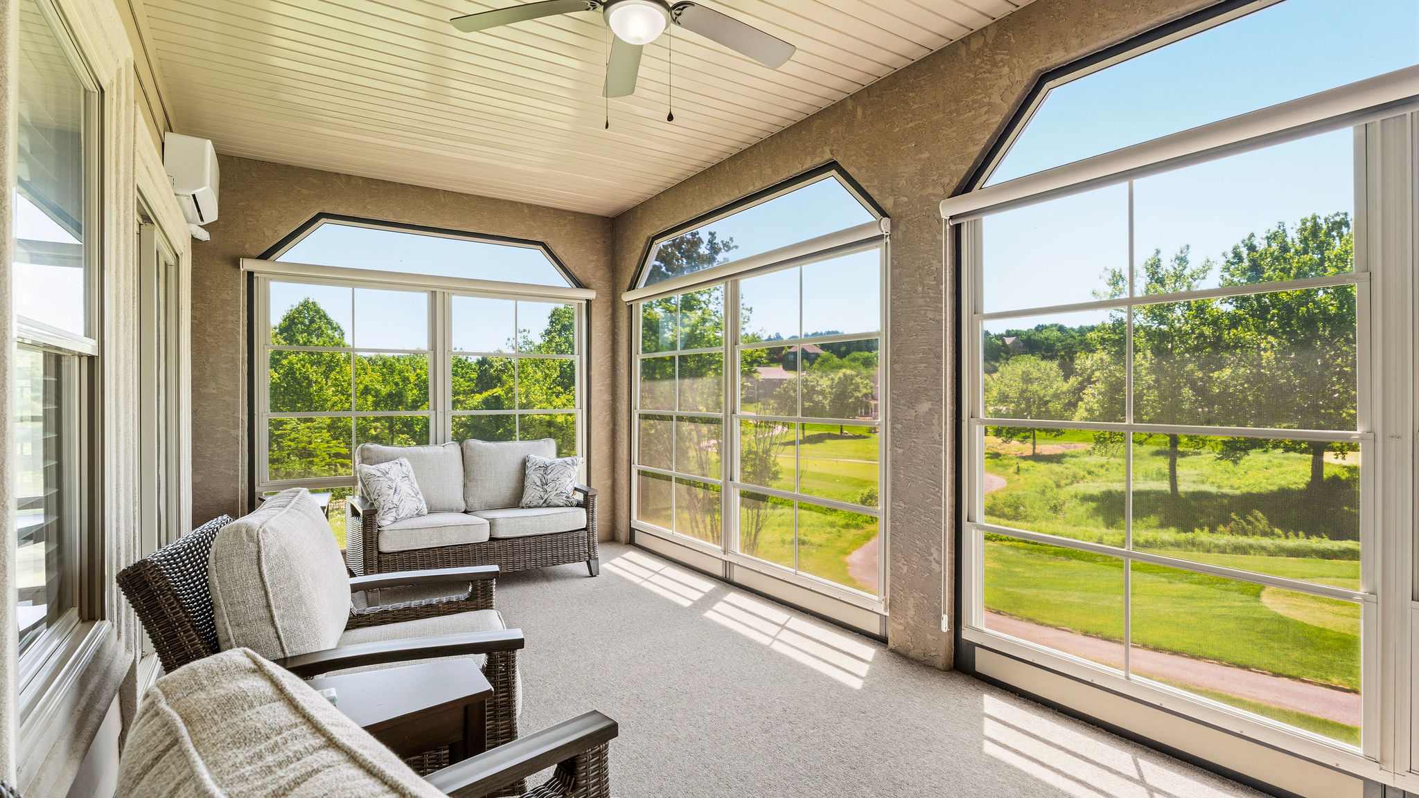 Sip morning coffee or an evening cocktail in the golf course-view sunroom​