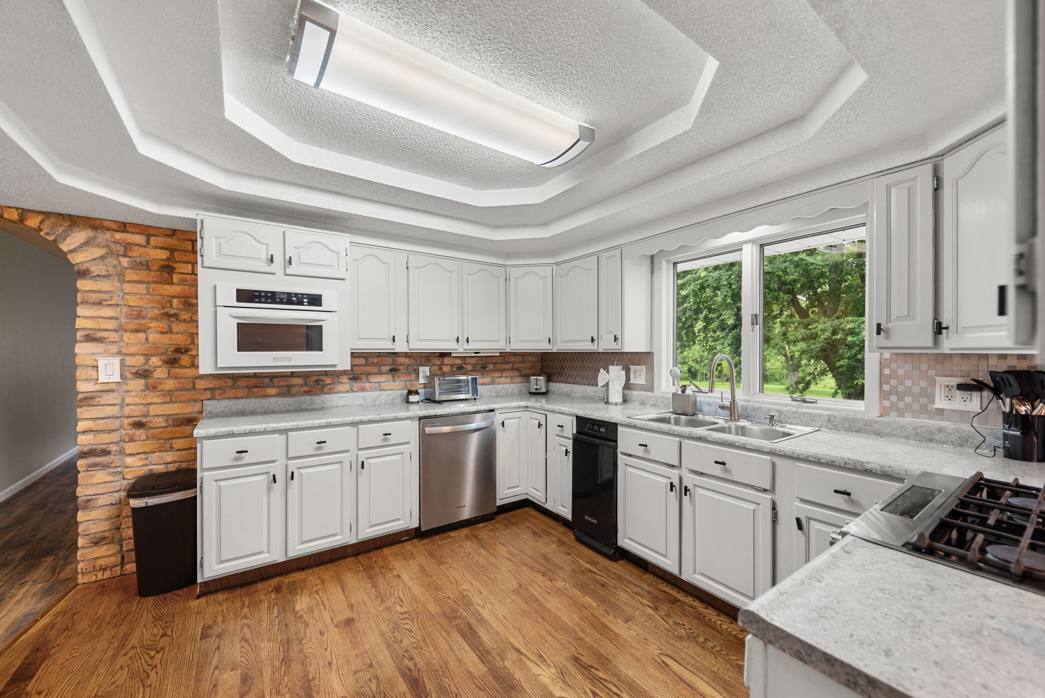 Main level kitchen with expansive counters for easy group cooking.