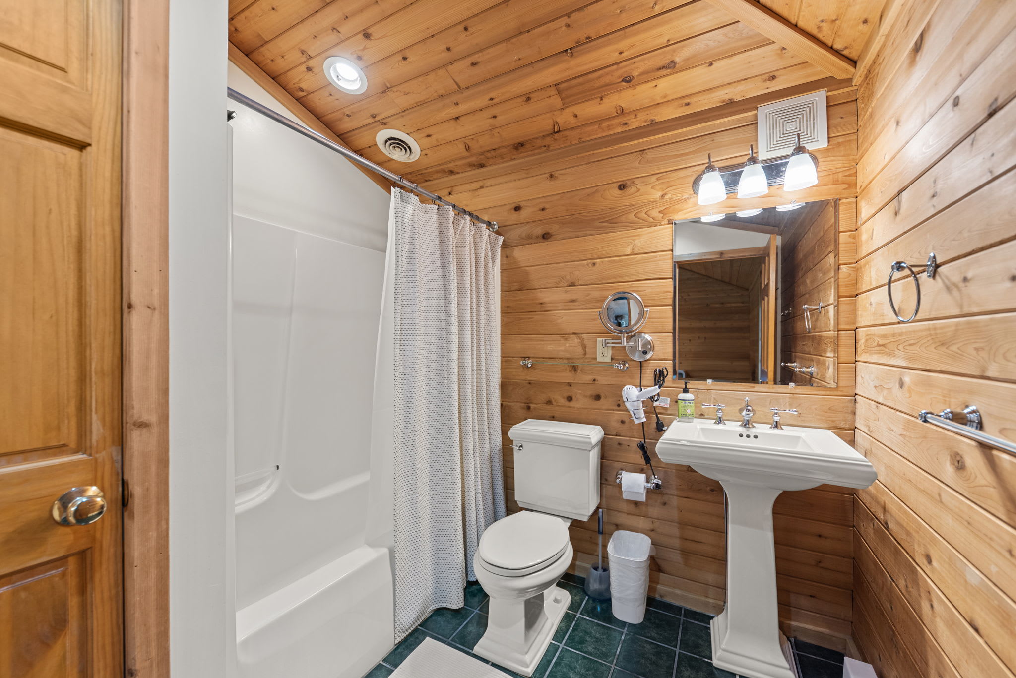 Full bath with a tub and shower gives guests flexible daily routines.