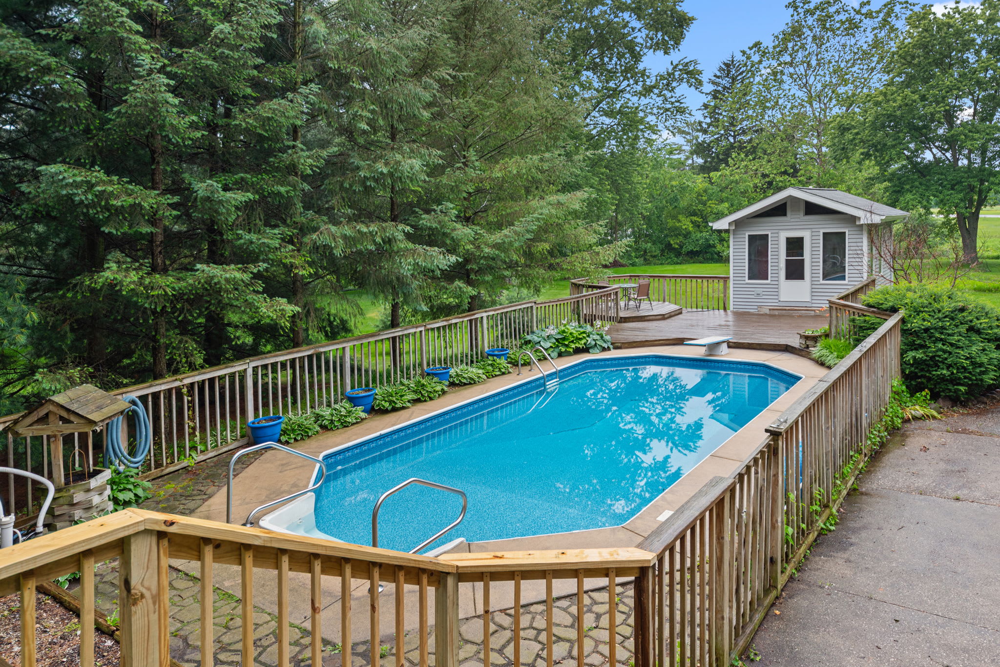 Private pool with surrounding deck creates space for all day outdoor fun.