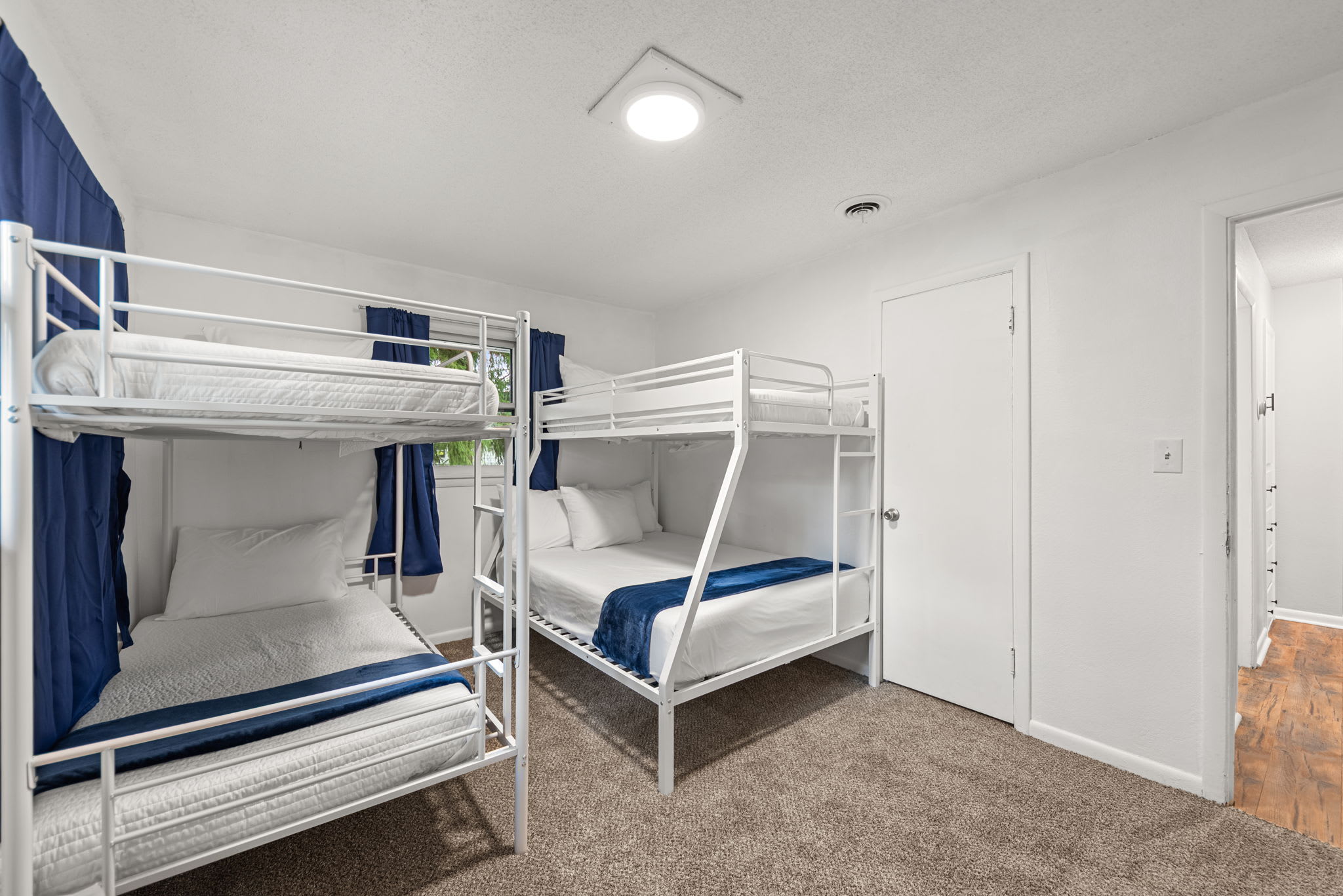 Bedroom 4 is located on the upper level with single over double bunk bed and single bunk bed.