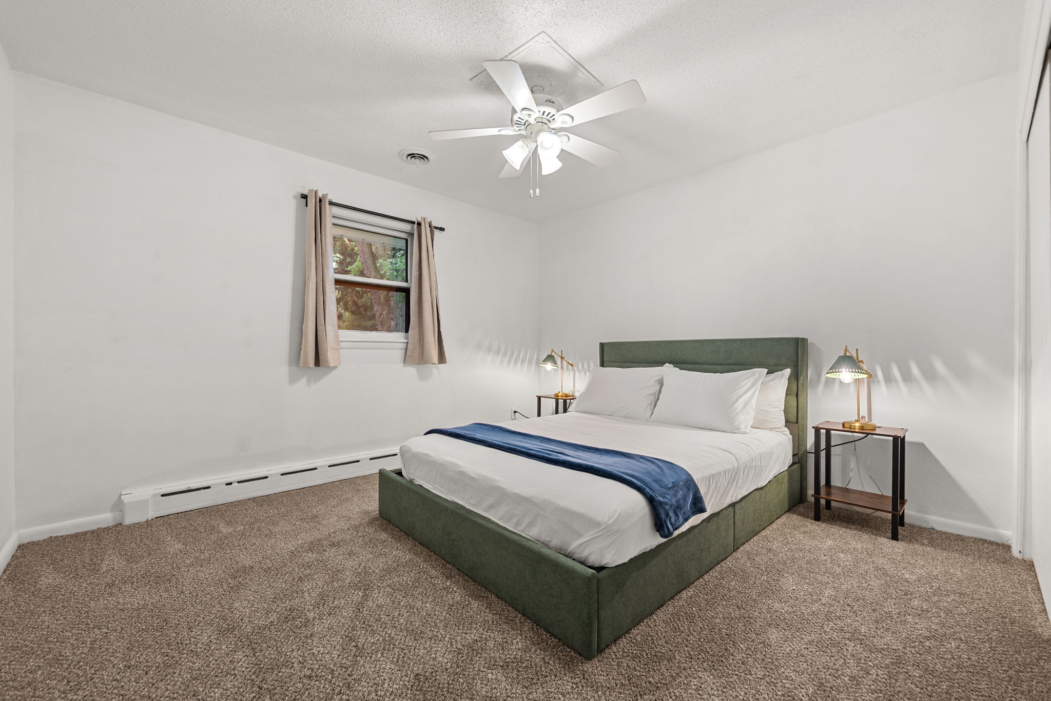 Bedroom 2 is located on the upper level with queen-sized bed.